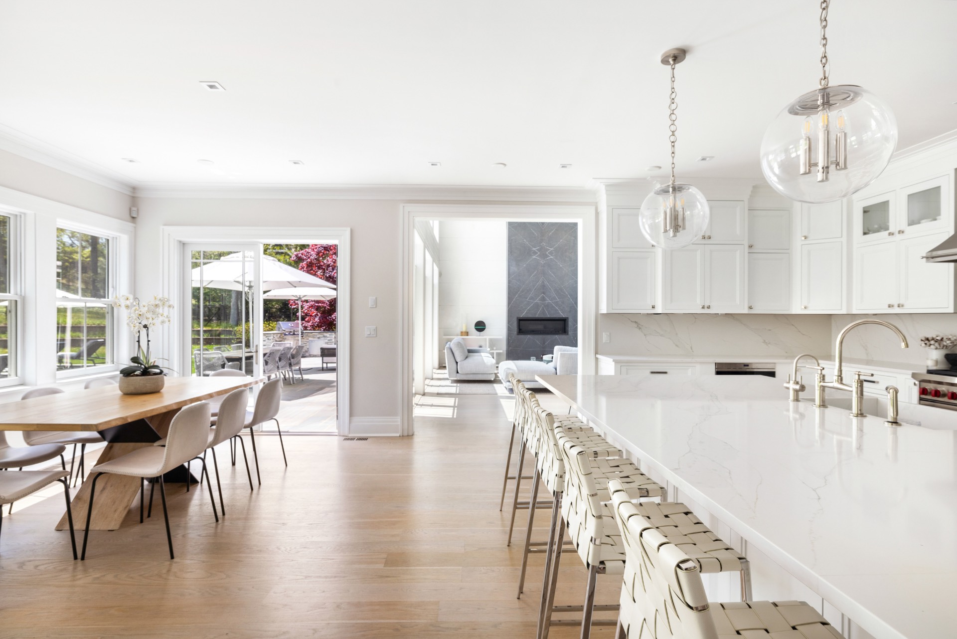 8 Shady Pth Bridgehampton, NY 11963 - Photo 13 of 45 a very nice looking dining room with wooden floor and a chandelier