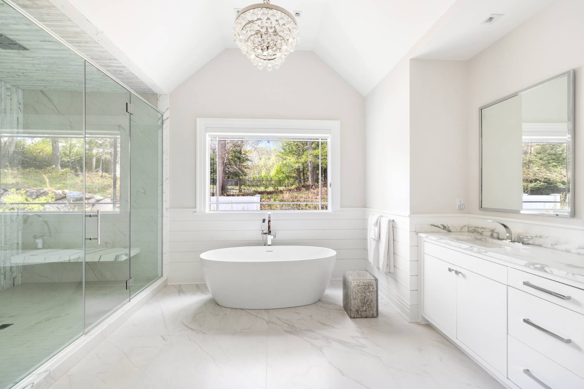 8 Shady Pth Bridgehampton, NY 11963 - Photo 24 of 45 a spacious bathroom with a sink mirror and a bathtub