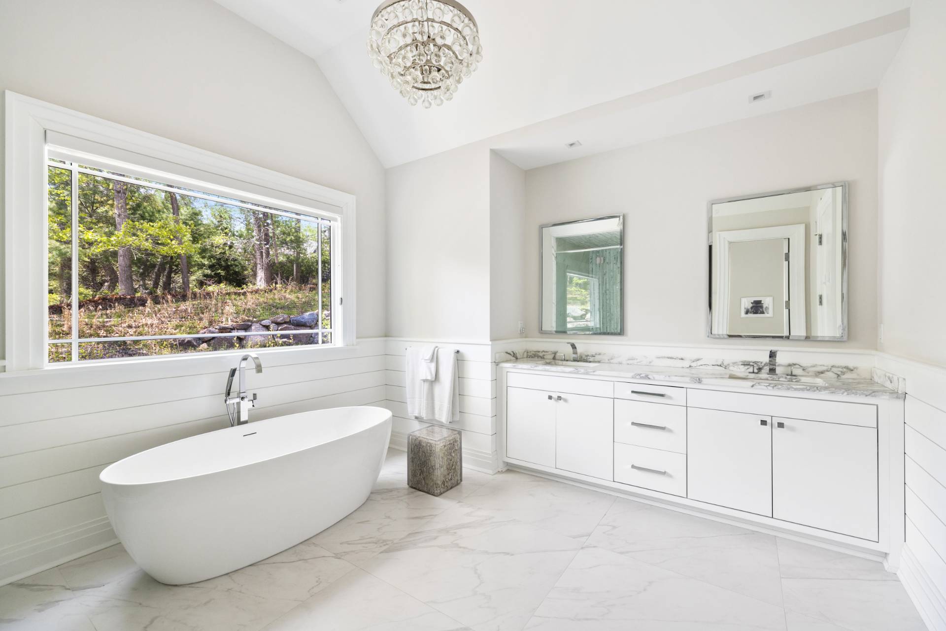 8 Shady Pth Bridgehampton, NY 11963 - Photo 25 of 45 a bathroom with a double vanity sink a mirror and a bathtub