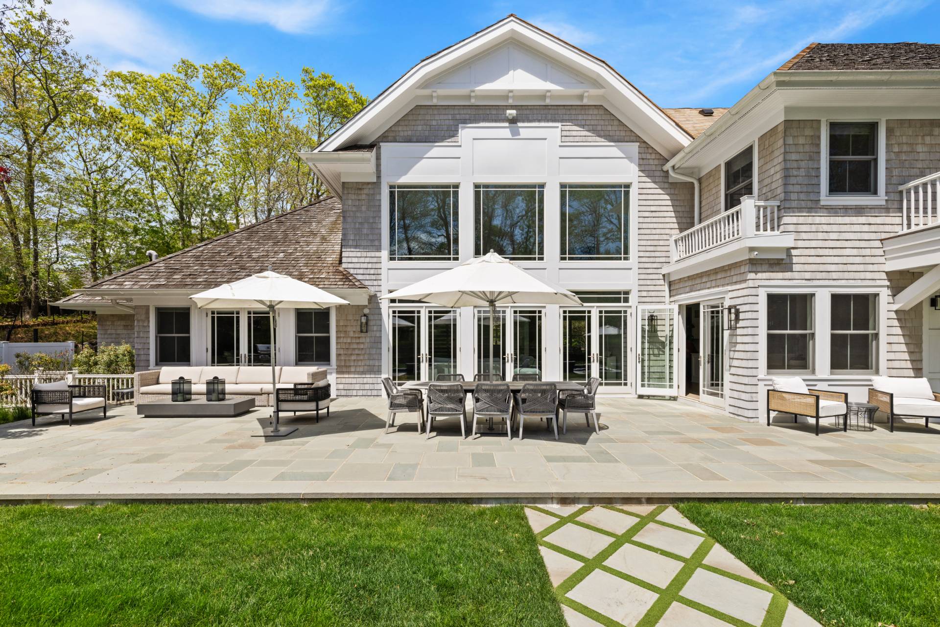 8 Shady Pth Bridgehampton, NY 11963 - Photo 30 of 45 a front view of a residential apartment building with a yard