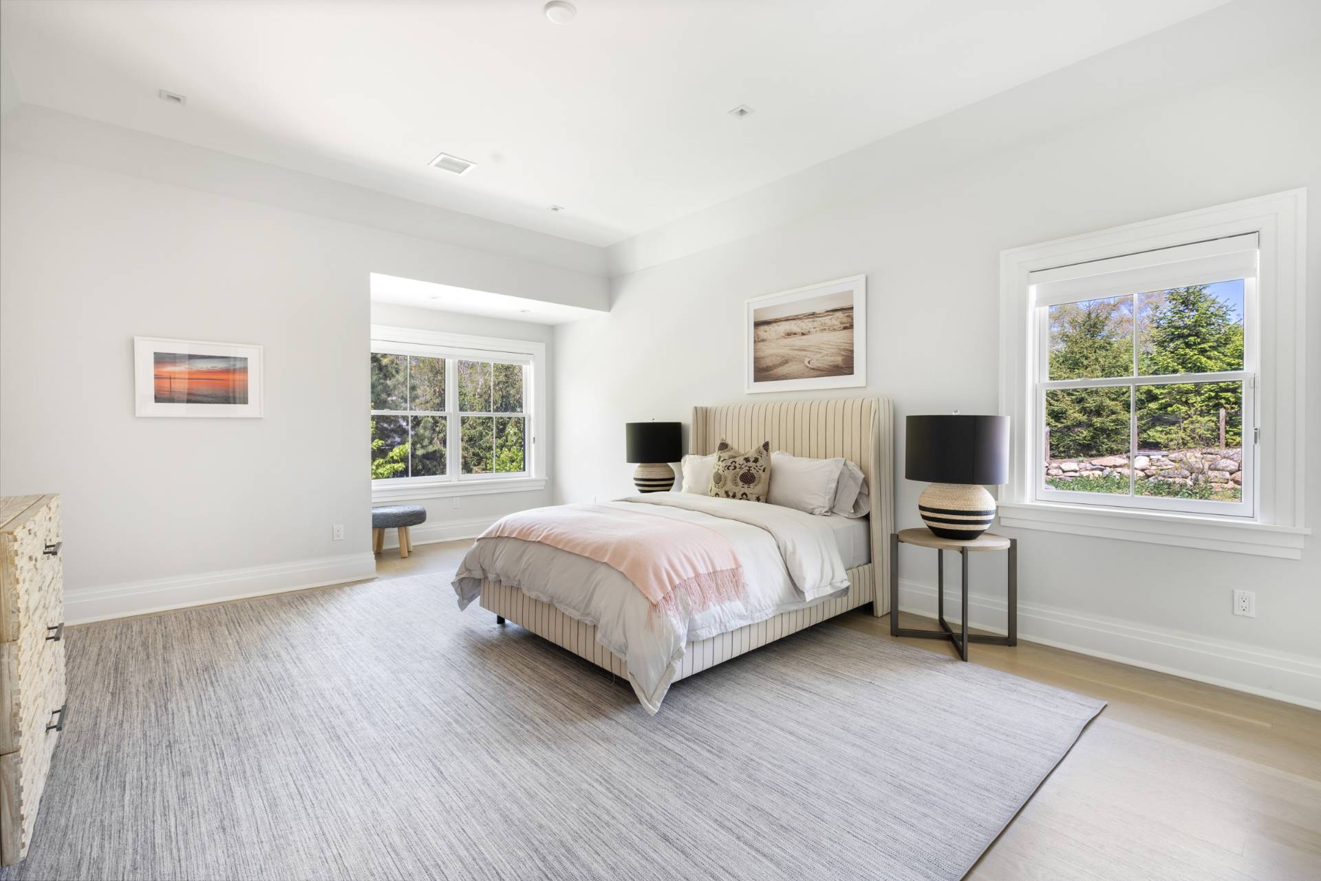 8 Shady Pth Bridgehampton, NY 11963 - Photo 34 of 45 a bedroom with a large bed and a large window