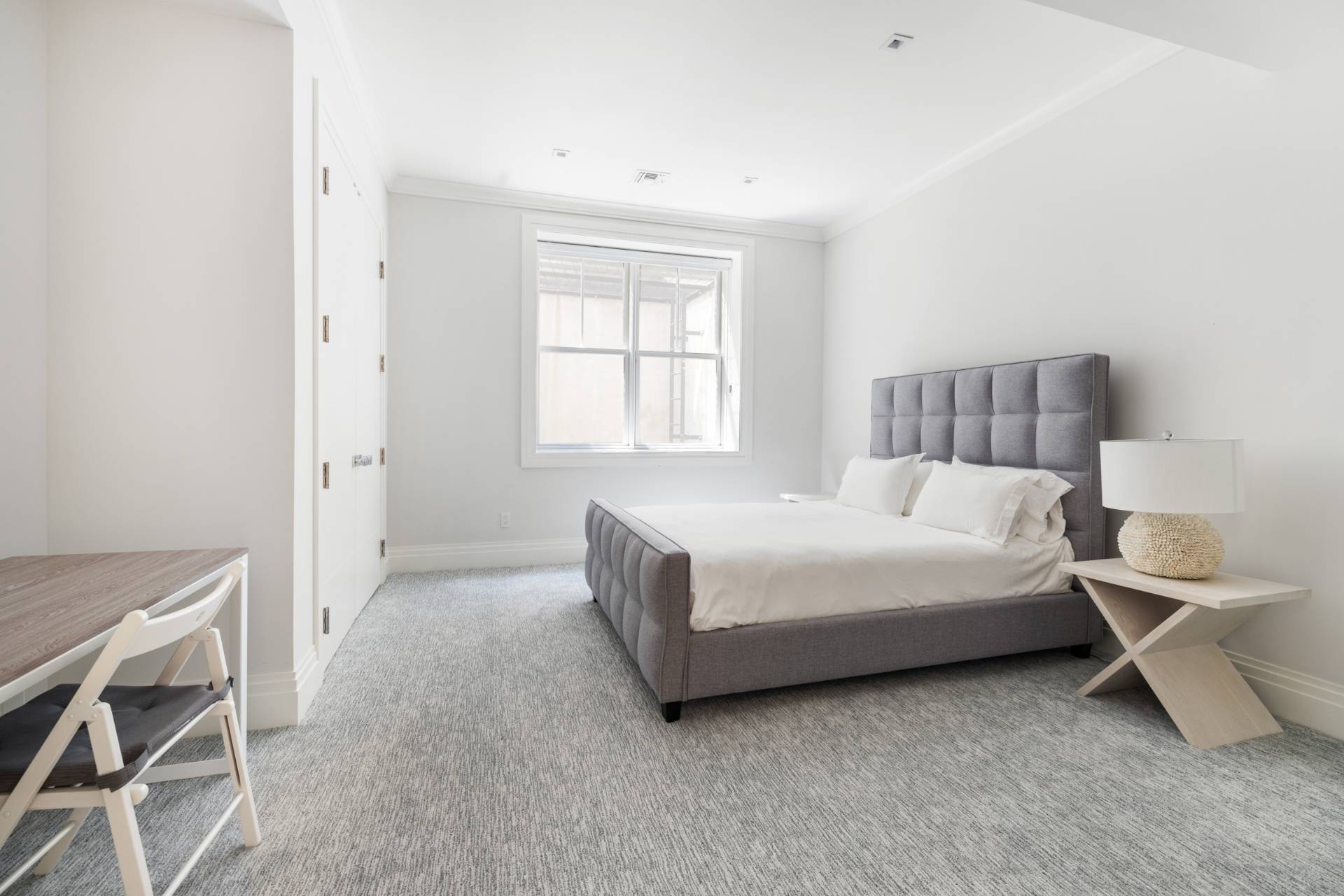 8 Shady Pth Bridgehampton, NY 11963 - Photo 38 of 45 a bed room with a bed and a chair