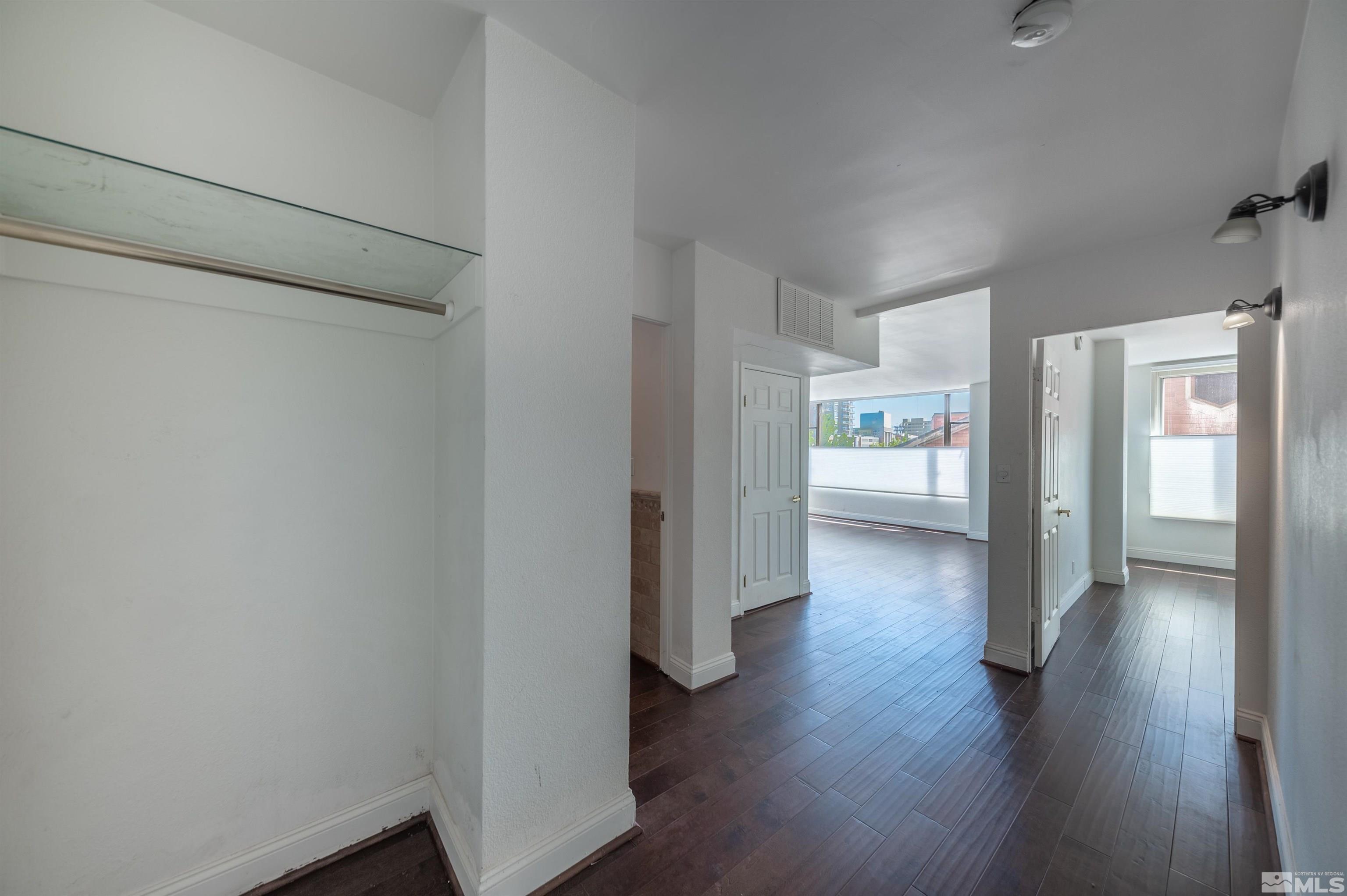 280 Island Avenue, Unit 305 Reno, NV 89501 - Photo 4 of 34 a view of a hallway with wooden floor