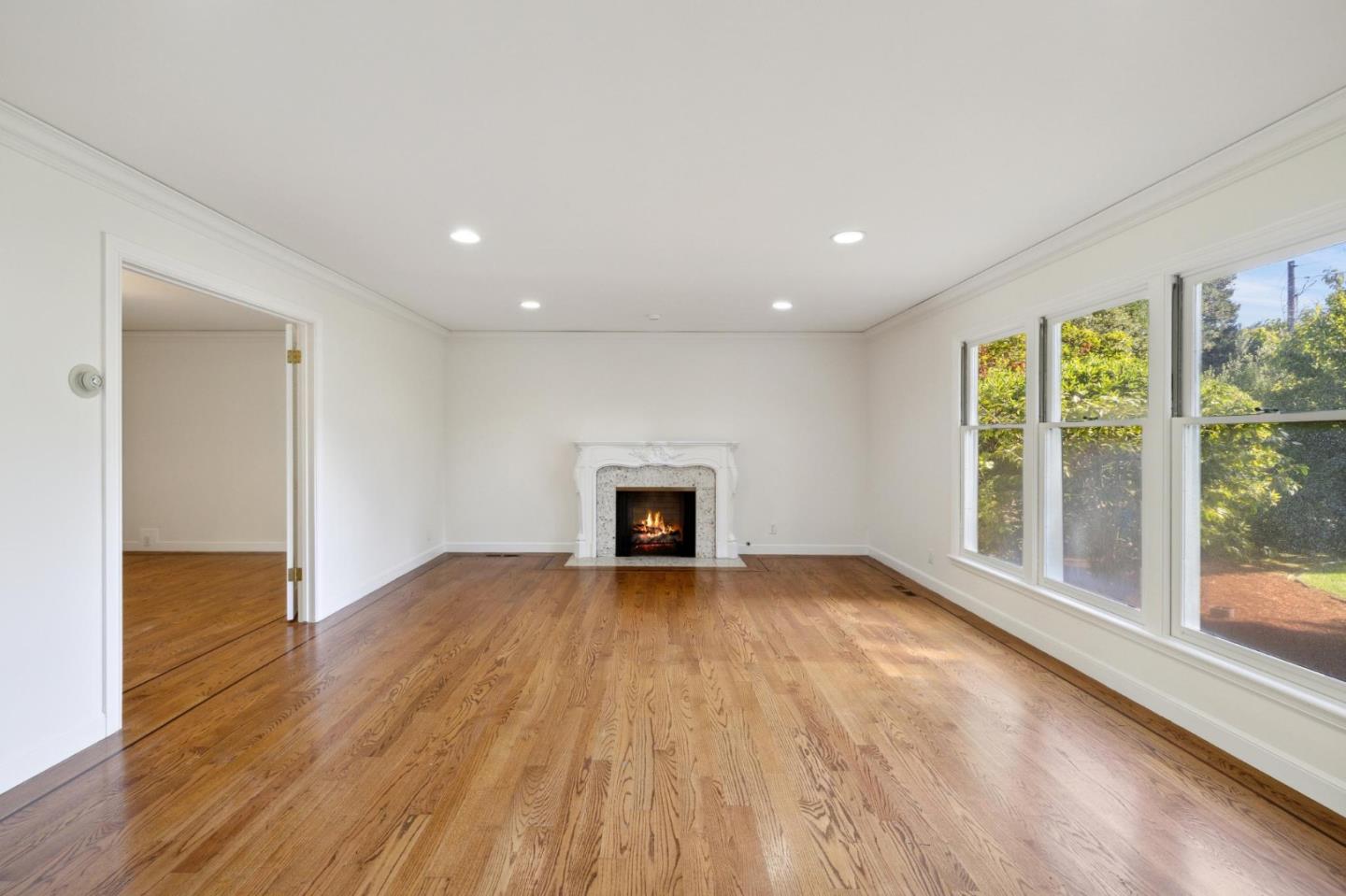 243 Selby Lane Atherton, CA 94027 - Photo 11 of 90 a view of an empty room with wooden floor and a window