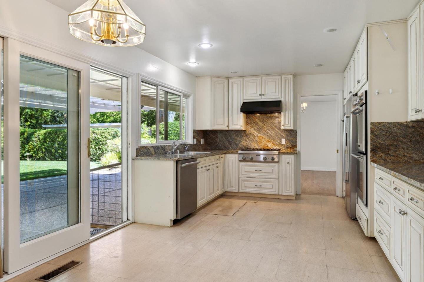243 Selby Lane Atherton, CA 94027 - Photo 19 of 90 a kitchen with stainless steel appliances a stove a sink and a refrigerator