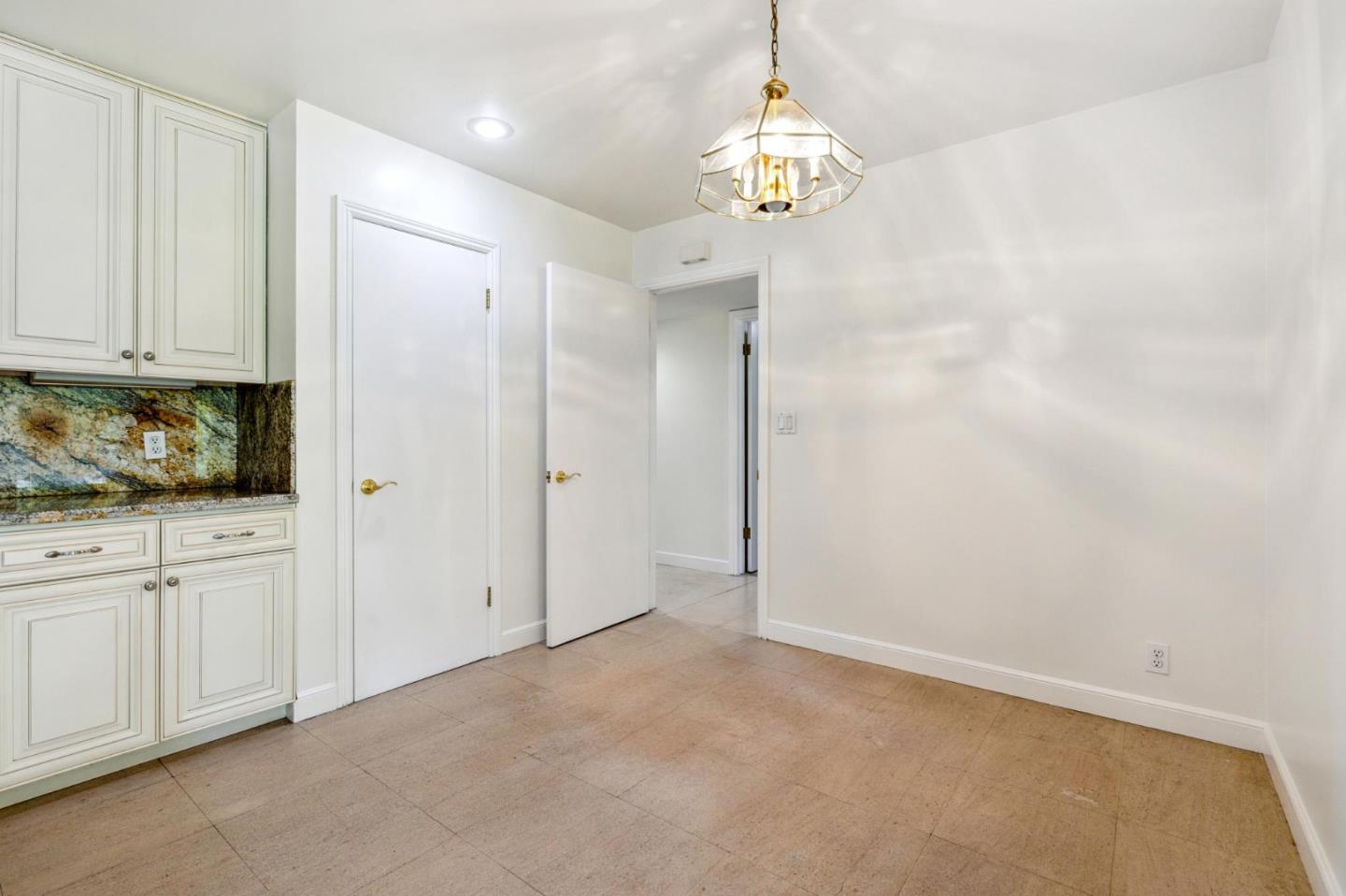 243 Selby Lane Atherton, CA 94027 - Photo 23 of 90 a view of an empty room and chandelier