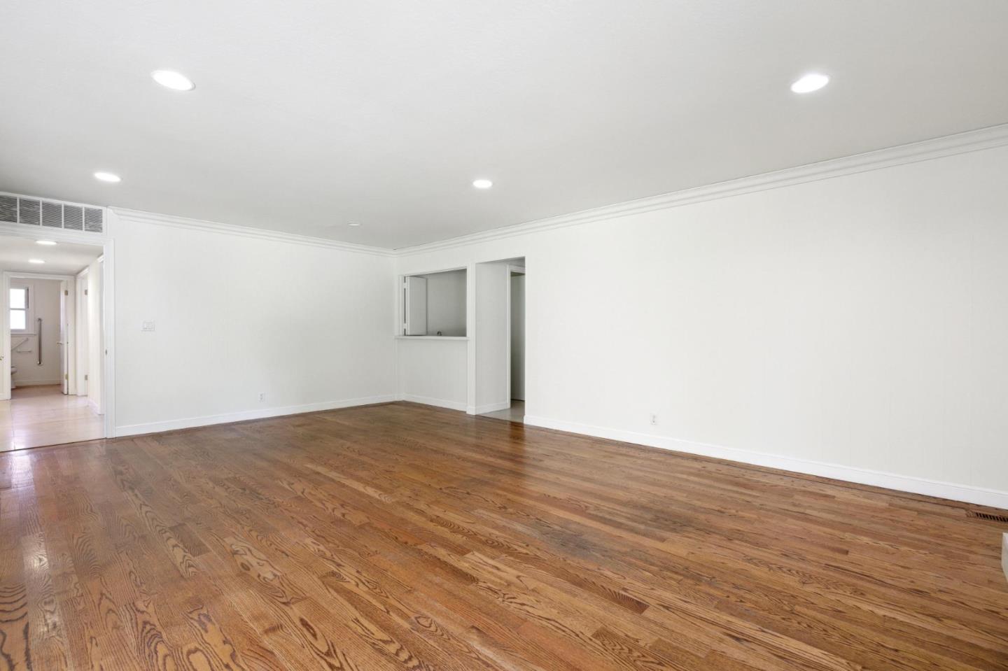 243 Selby Lane Atherton, CA 94027 - Photo 26 of 90 a view of an empty room with wooden floor