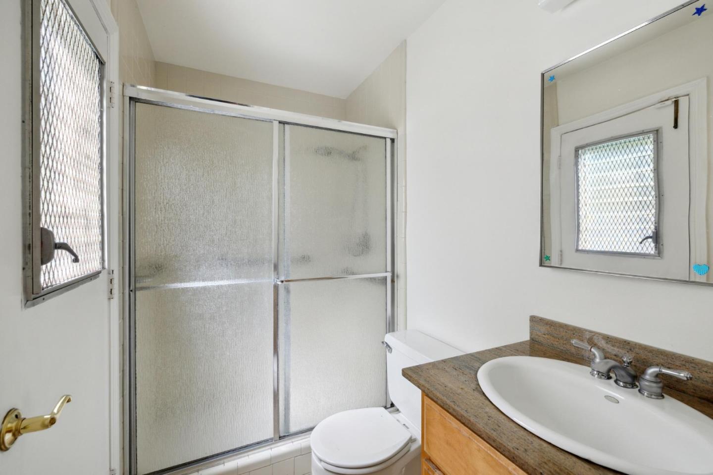 243 Selby Lane Atherton, CA 94027 - Photo 29 of 90 a bathroom with a sink toilet and shower