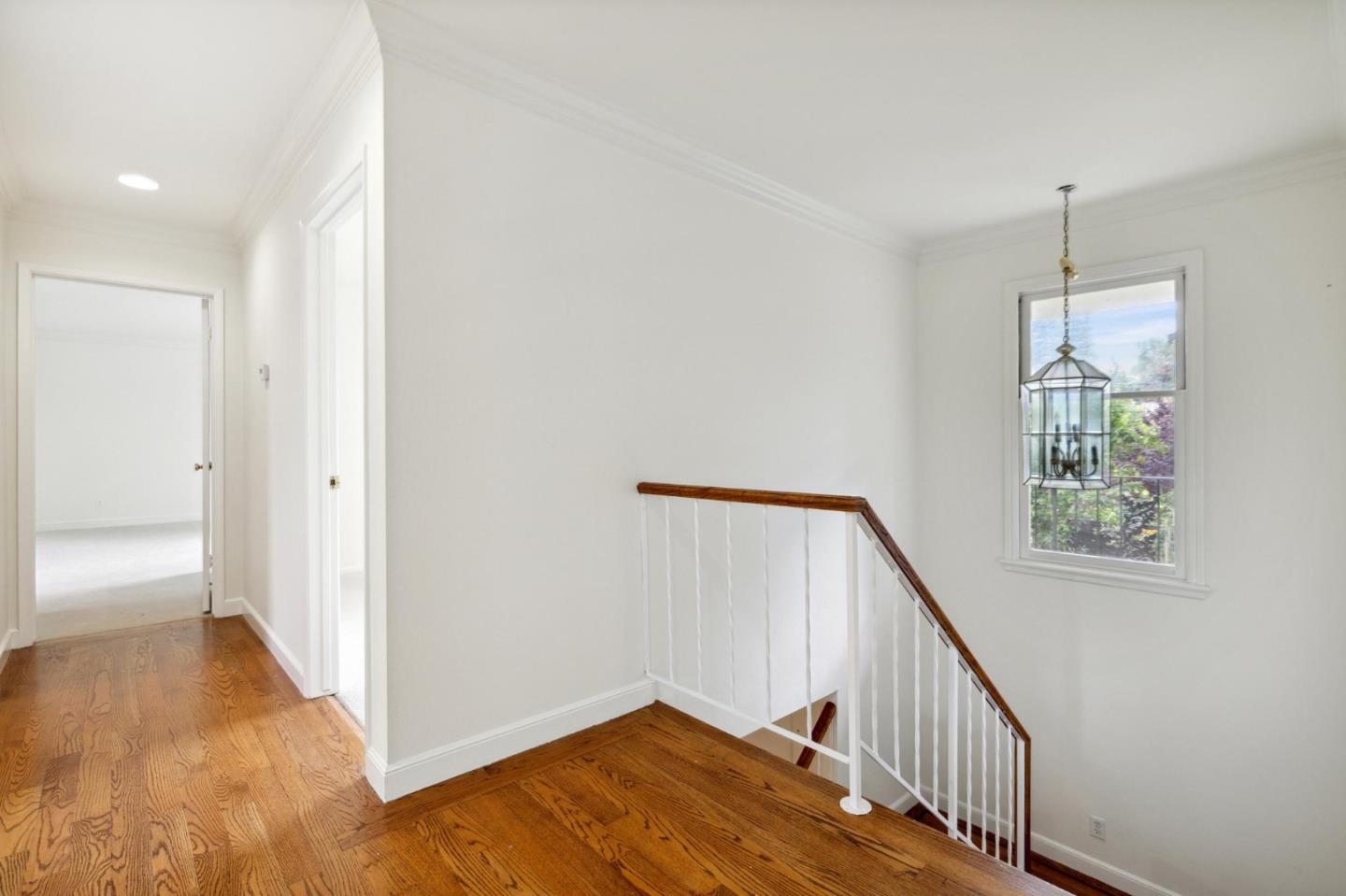 243 Selby Lane Atherton, CA 94027 - Photo 31 of 90 a view of a hallway with wooden floor and entryway