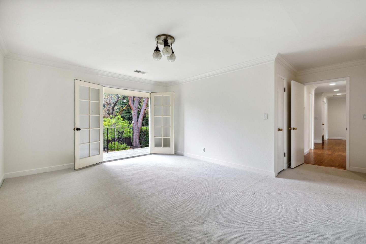 243 Selby Lane Atherton, CA 94027 - Photo 33 of 90 a view of a livingroom with a ceiling fan and window