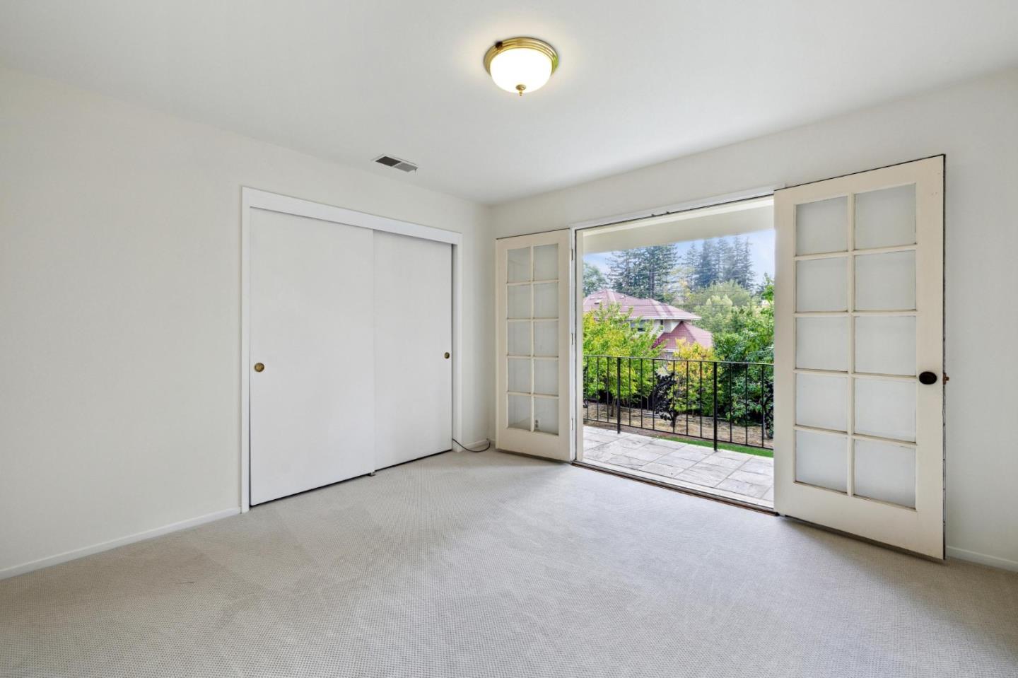 243 Selby Lane Atherton, CA 94027 - Photo 40 of 90 a view of empty room with floor to ceiling window