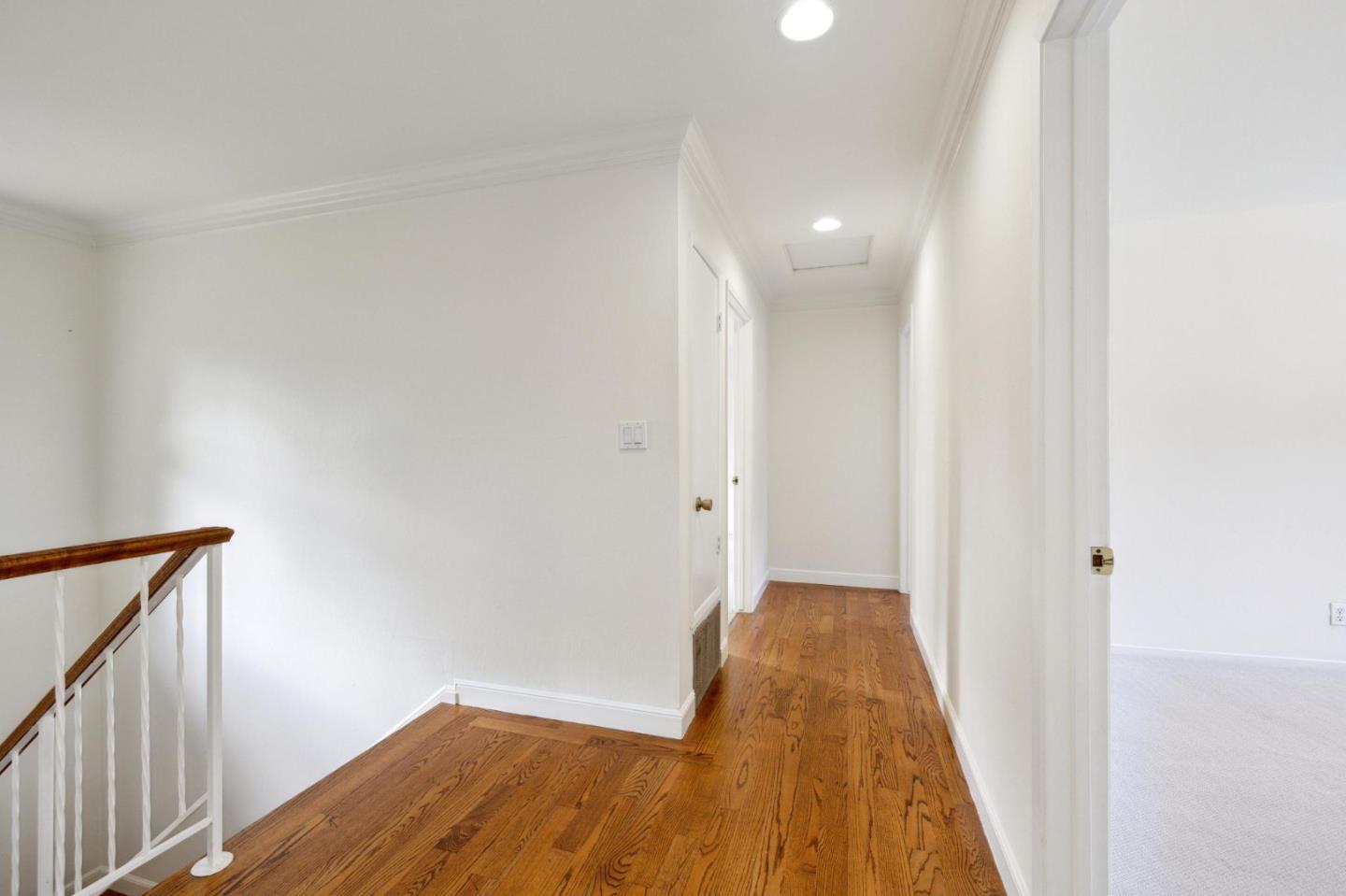 243 Selby Lane Atherton, CA 94027 - Photo 43 of 90 a view of a hallway with wooden floor
