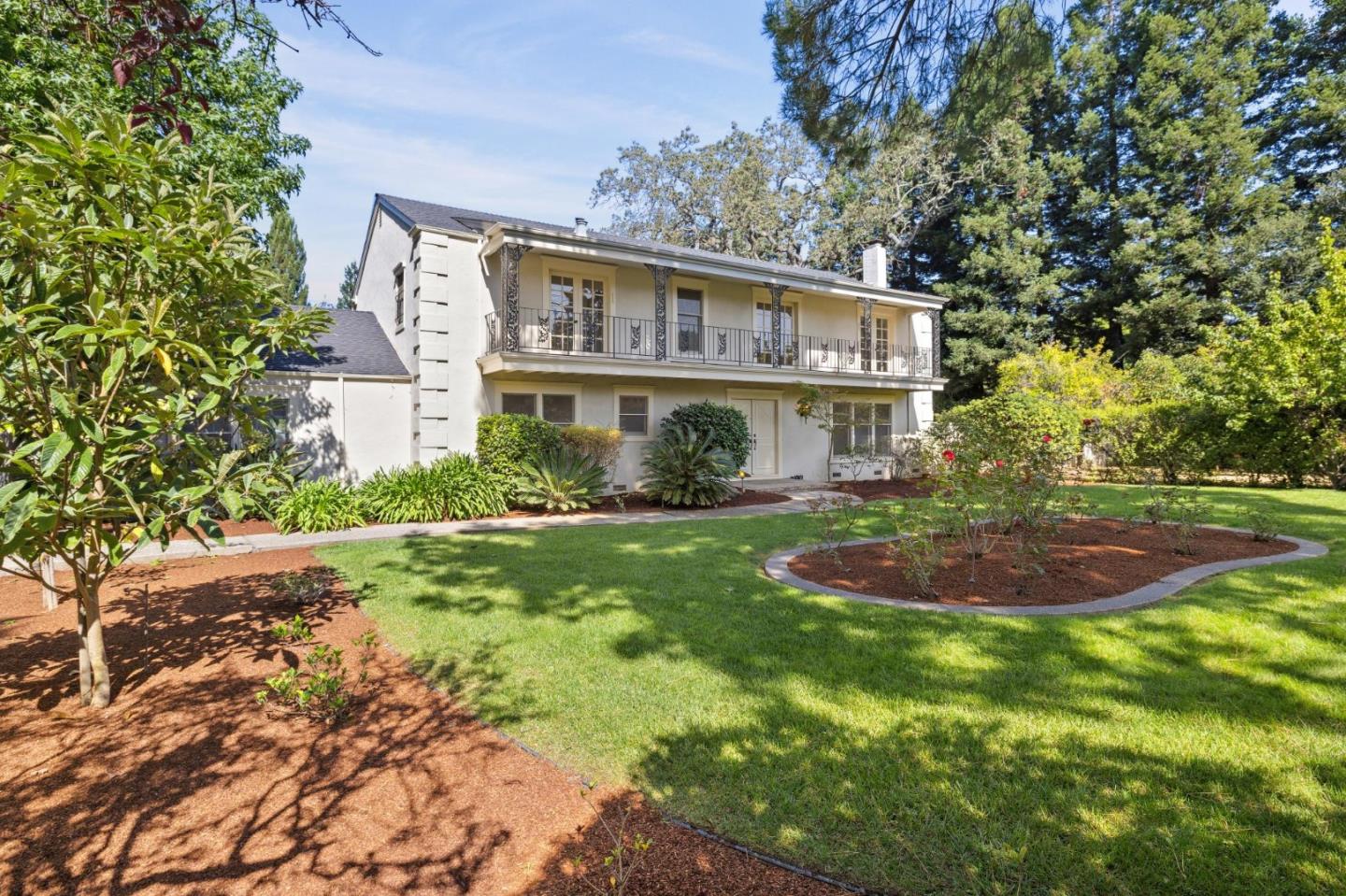 243 Selby Lane Atherton, CA 94027 - Photo 5 of 90 a front view of a house with a yard