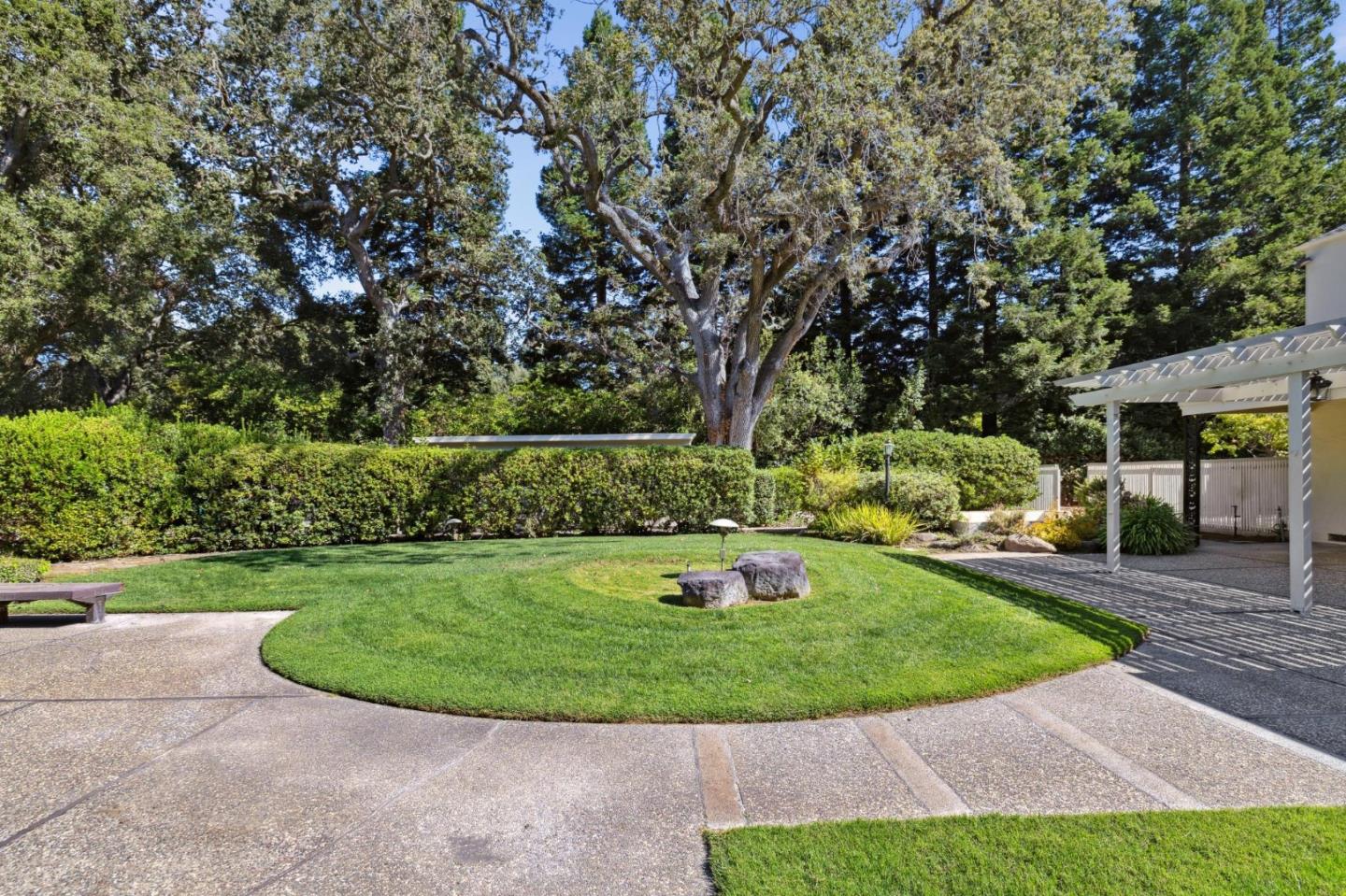 243 Selby Lane Atherton, CA 94027 - Photo 62 of 90 a view of a backyard with sitting area