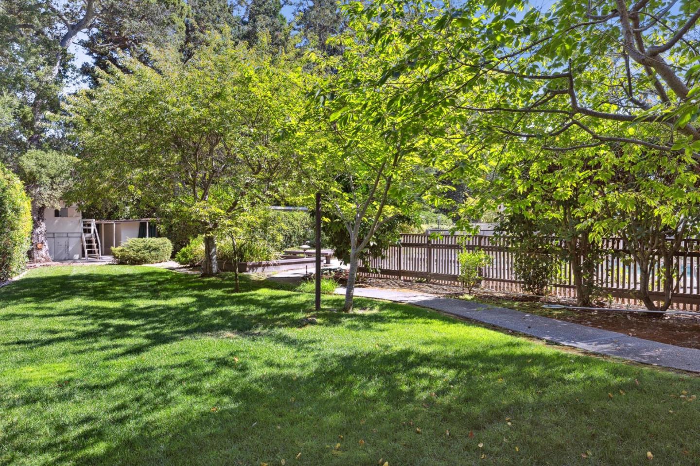243 Selby Lane Atherton, CA 94027 - Photo 70 of 90 a backyard of a house with table and chairs