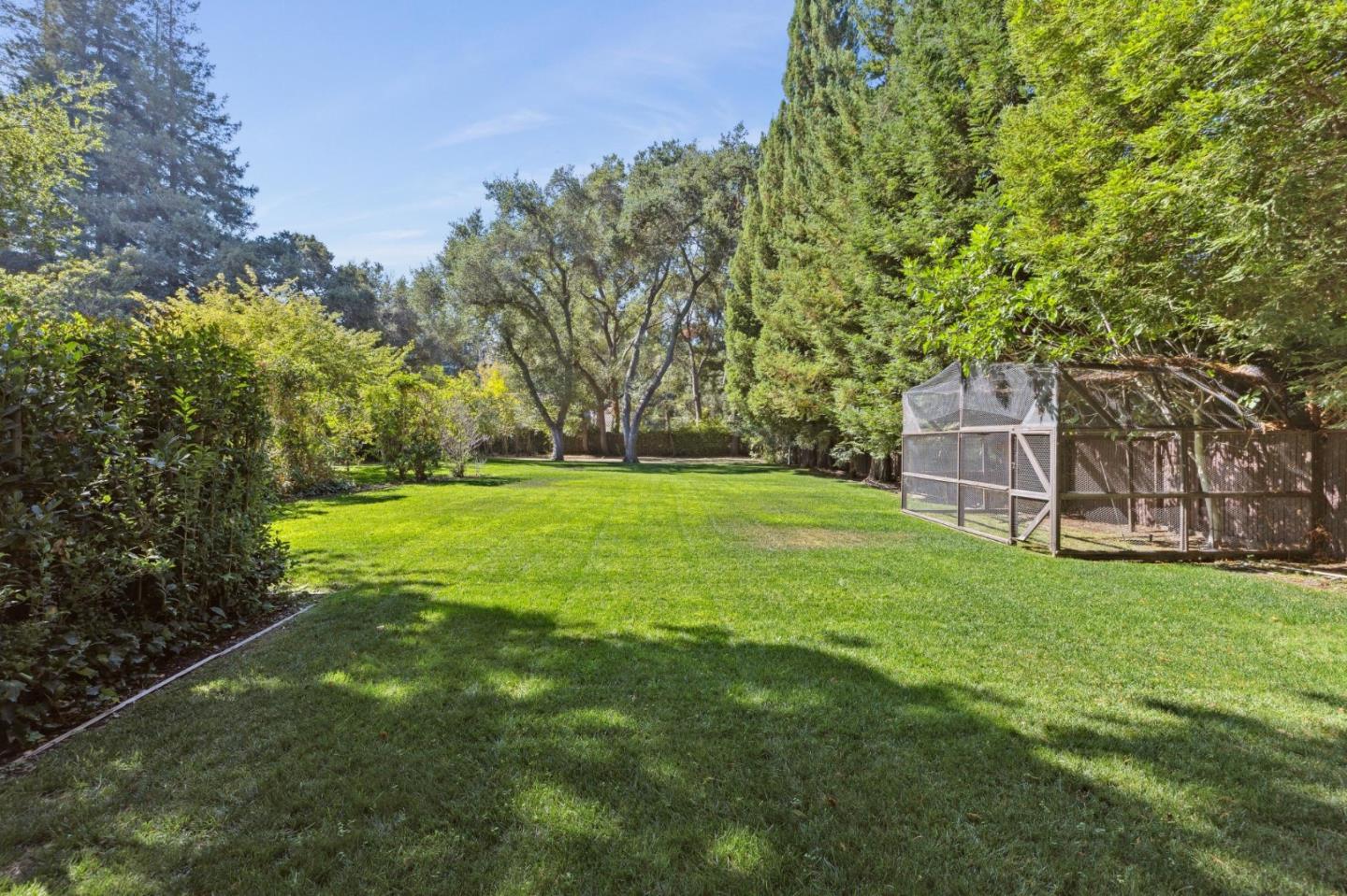 243 Selby Lane Atherton, CA 94027 - Photo 72 of 90 a backyard of a house with lots of green space and garden