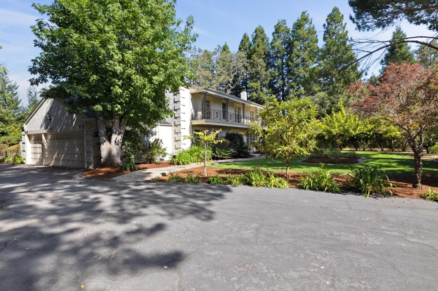 243 Selby Lane Atherton, CA 94027 - Photo 86 of 90 a view of a house with a yard and a garage