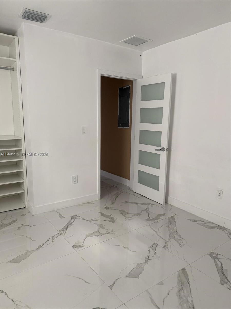 12540 Southwest 203rd Street, Unit 15240 Miami, FL 33177 - Photo 17 of 46 a view of a room with a empty space