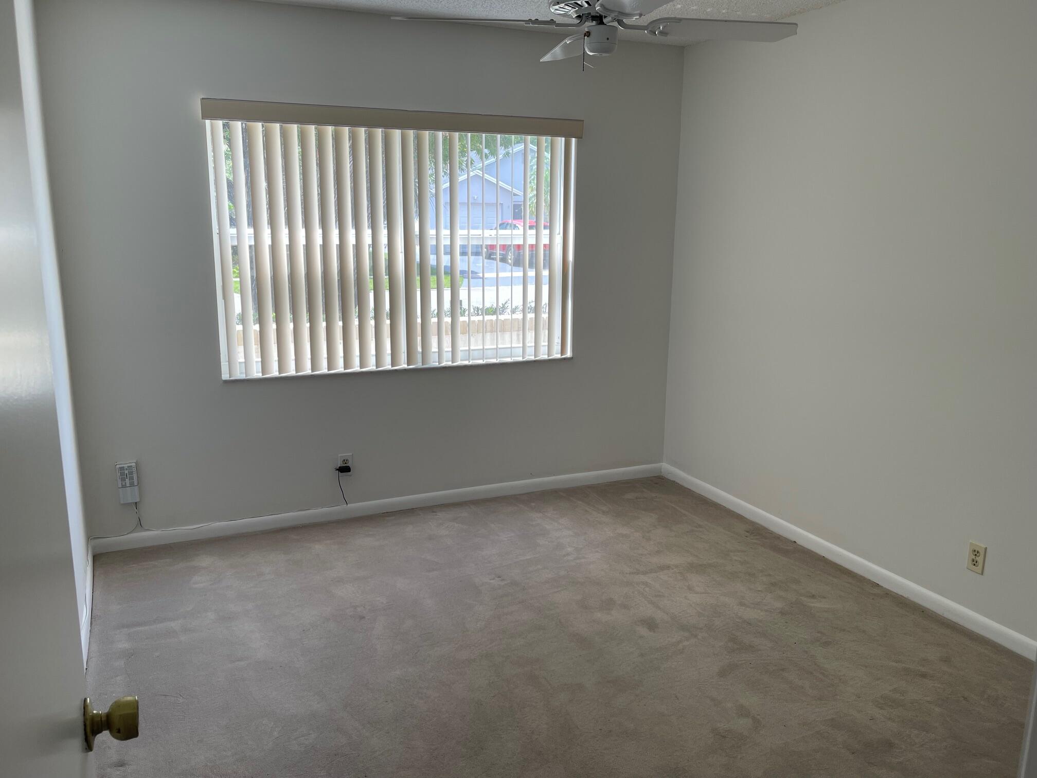 9151 Pine Springs Drive Boca Raton, FL 33428 - Photo 11 of 21 an empty room with a window