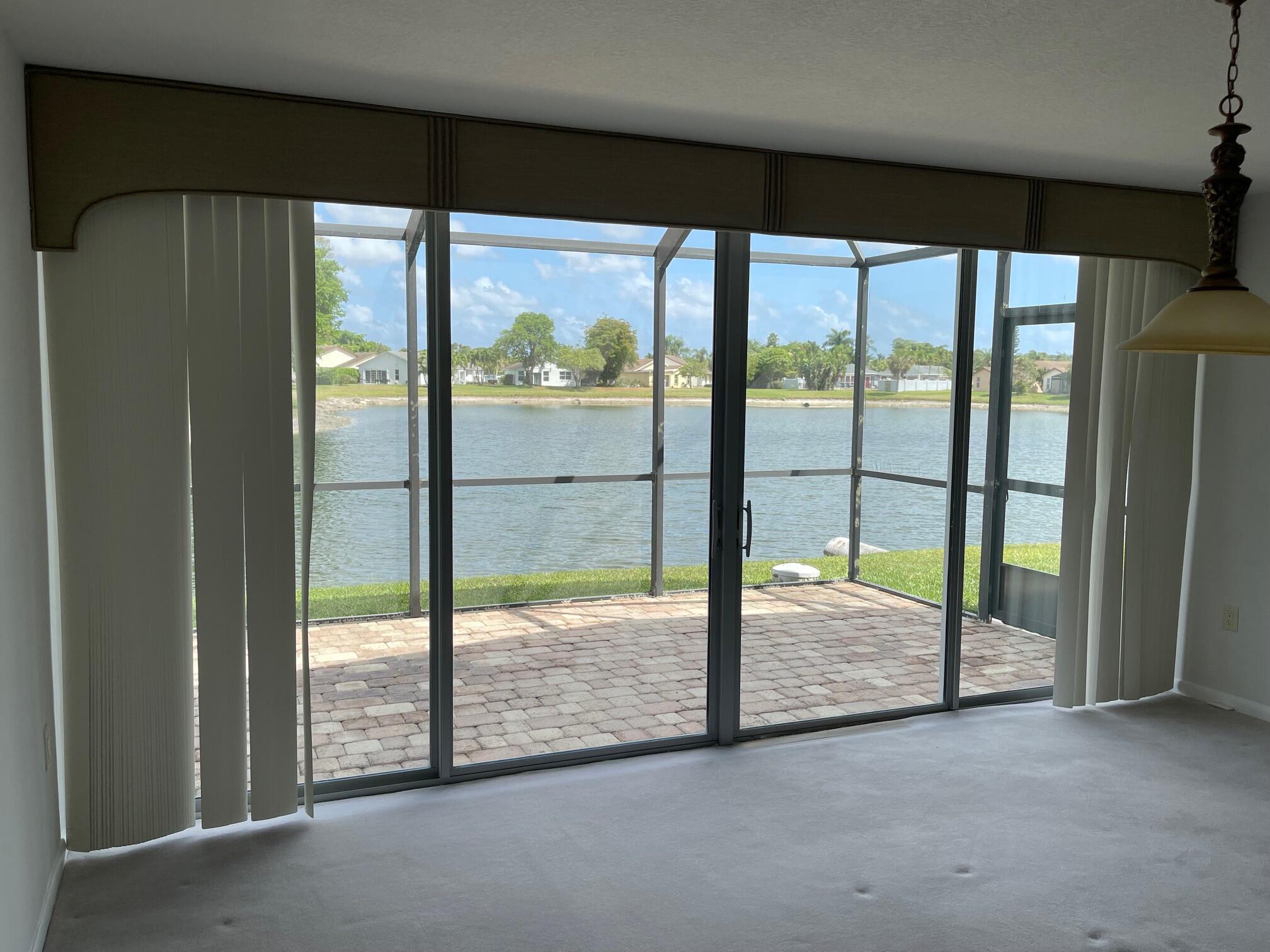 9151 Pine Springs Drive Boca Raton, FL 33428 - Photo 12 of 21 a view of empty room with front door