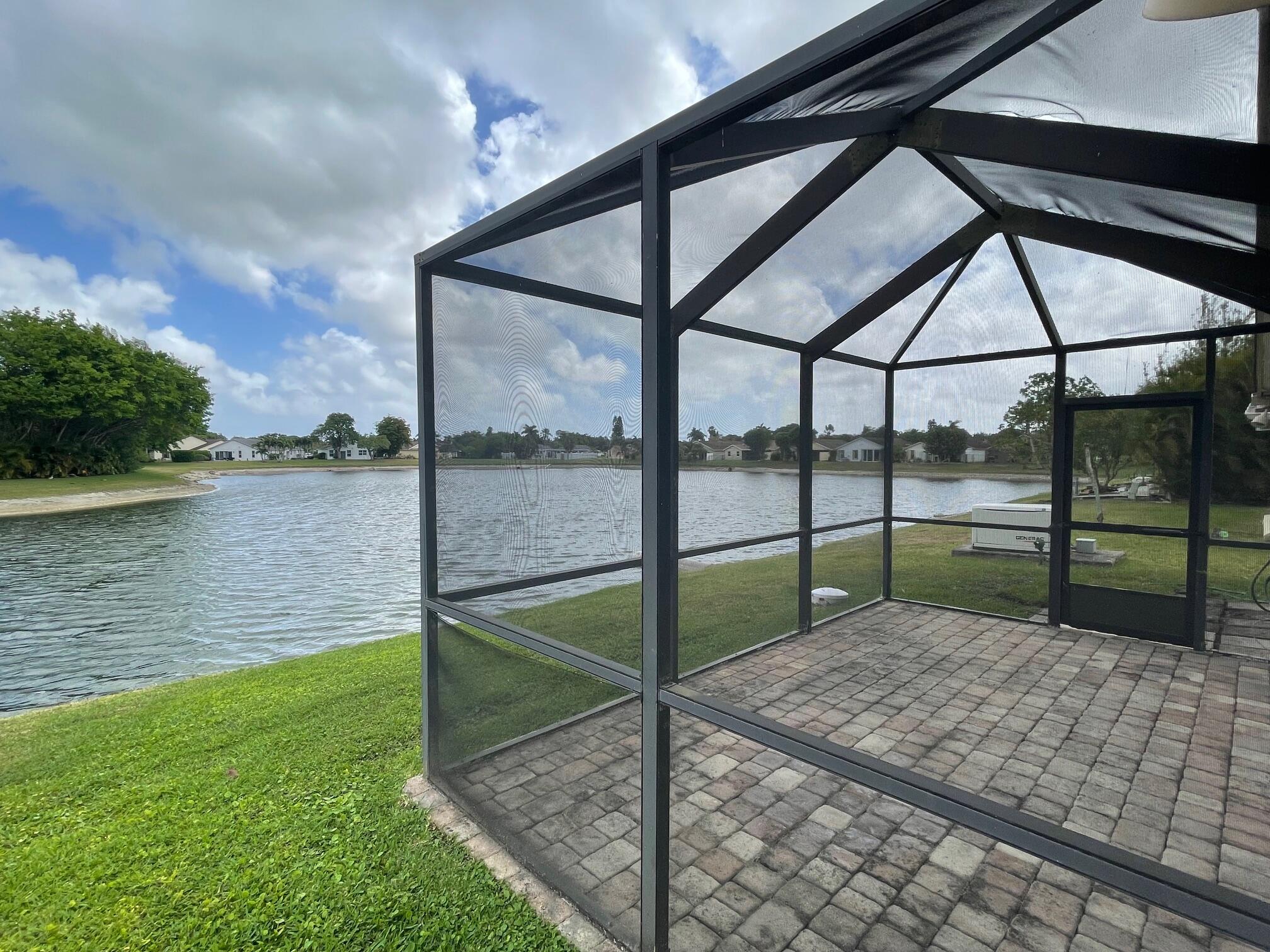 9151 Pine Springs Drive Boca Raton, FL 33428 - Photo 2 of 21 a view of a backyard