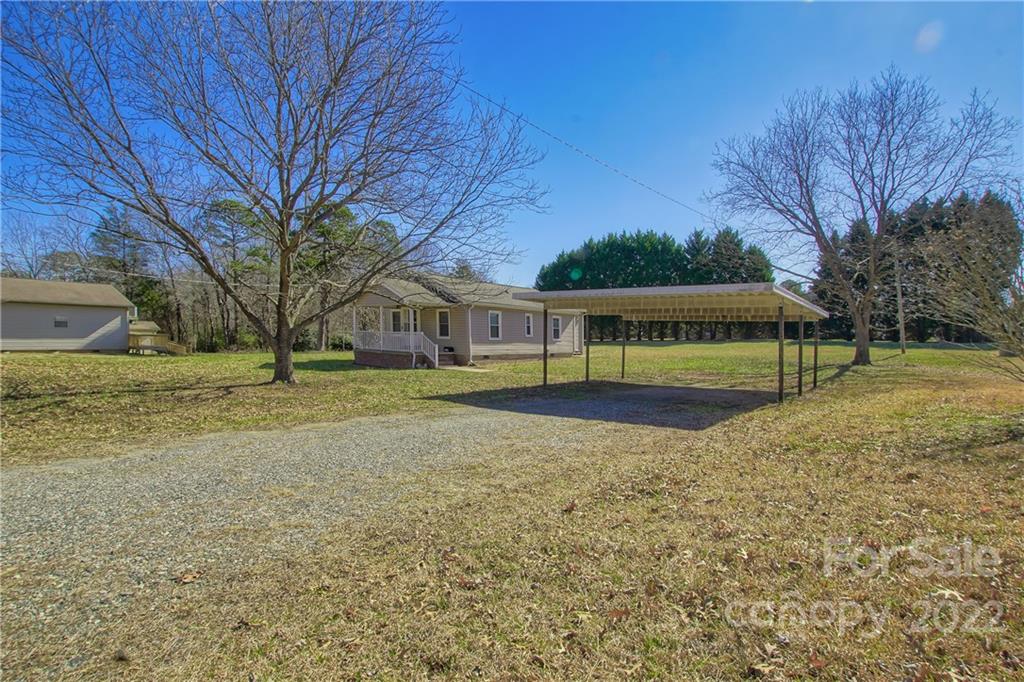 4106 Puetts Chapel Road Dallas, NC 28034 - Photo 2 of 23 a view of backyard with green space