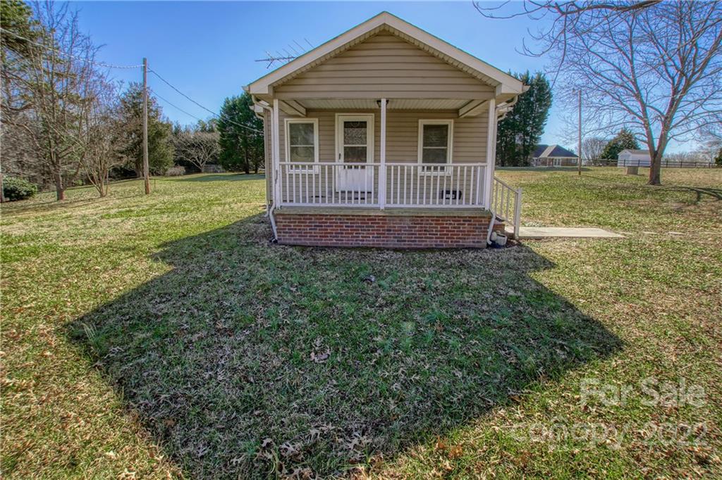 4106 Puetts Chapel Road Dallas, NC 28034 - Photo 3 of 23 a view of a house with a yard