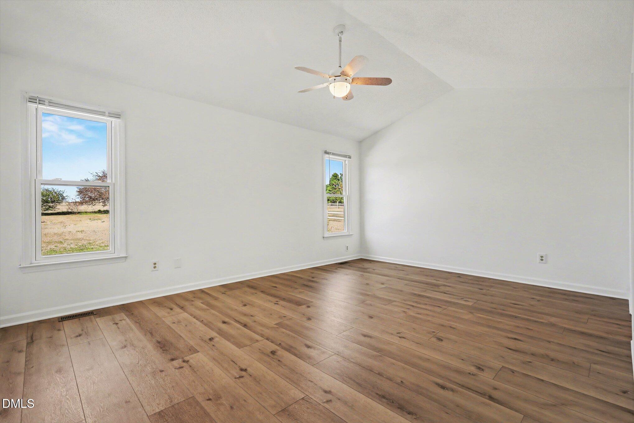 2004 Little Pond Place Willow Spring, NC 27592 - Photo 11 of 32 wooden floor in an empty room with a window
