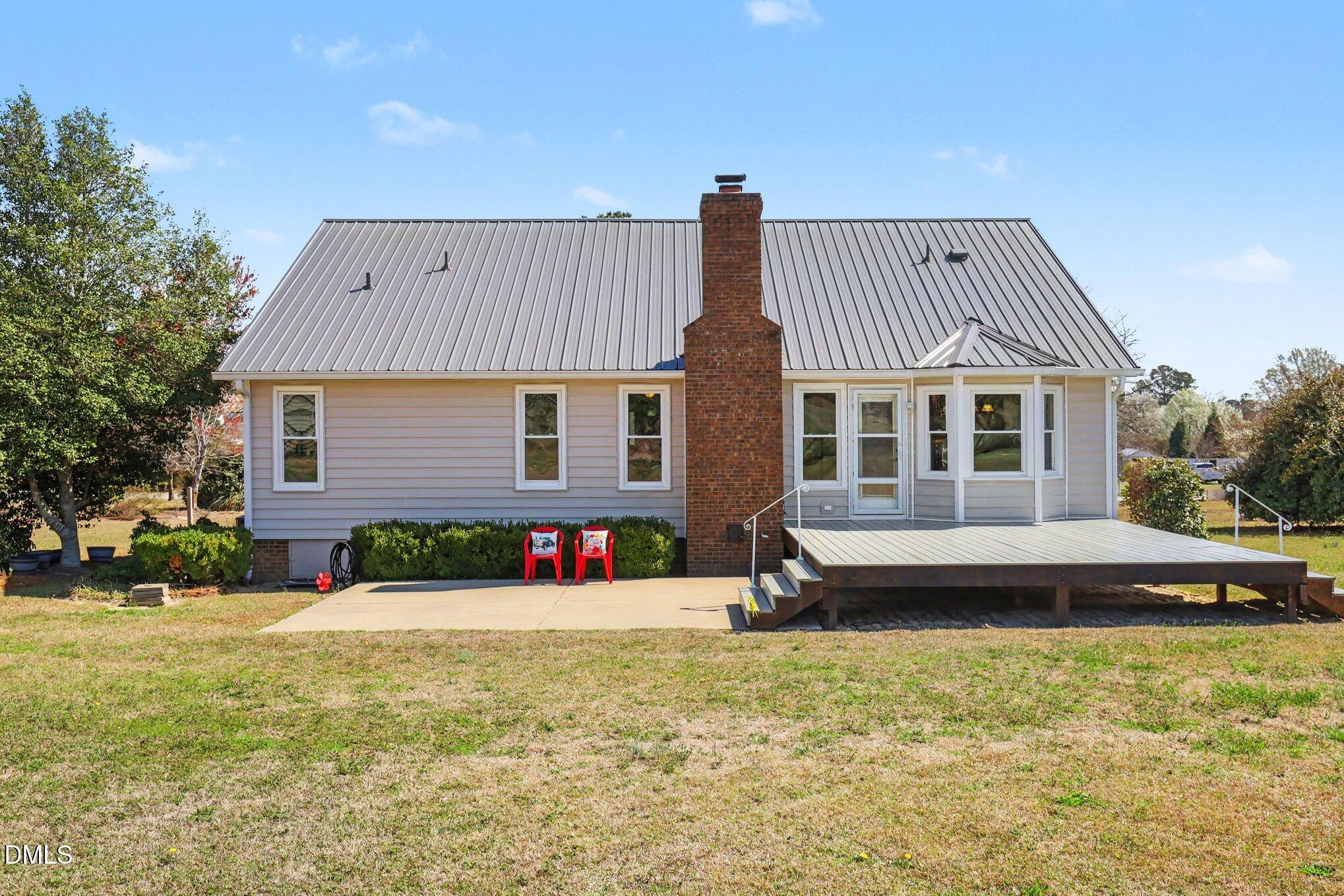 2004 Little Pond Place Willow Spring, NC 27592 - Photo 18 of 32 a front view of a house with a yard