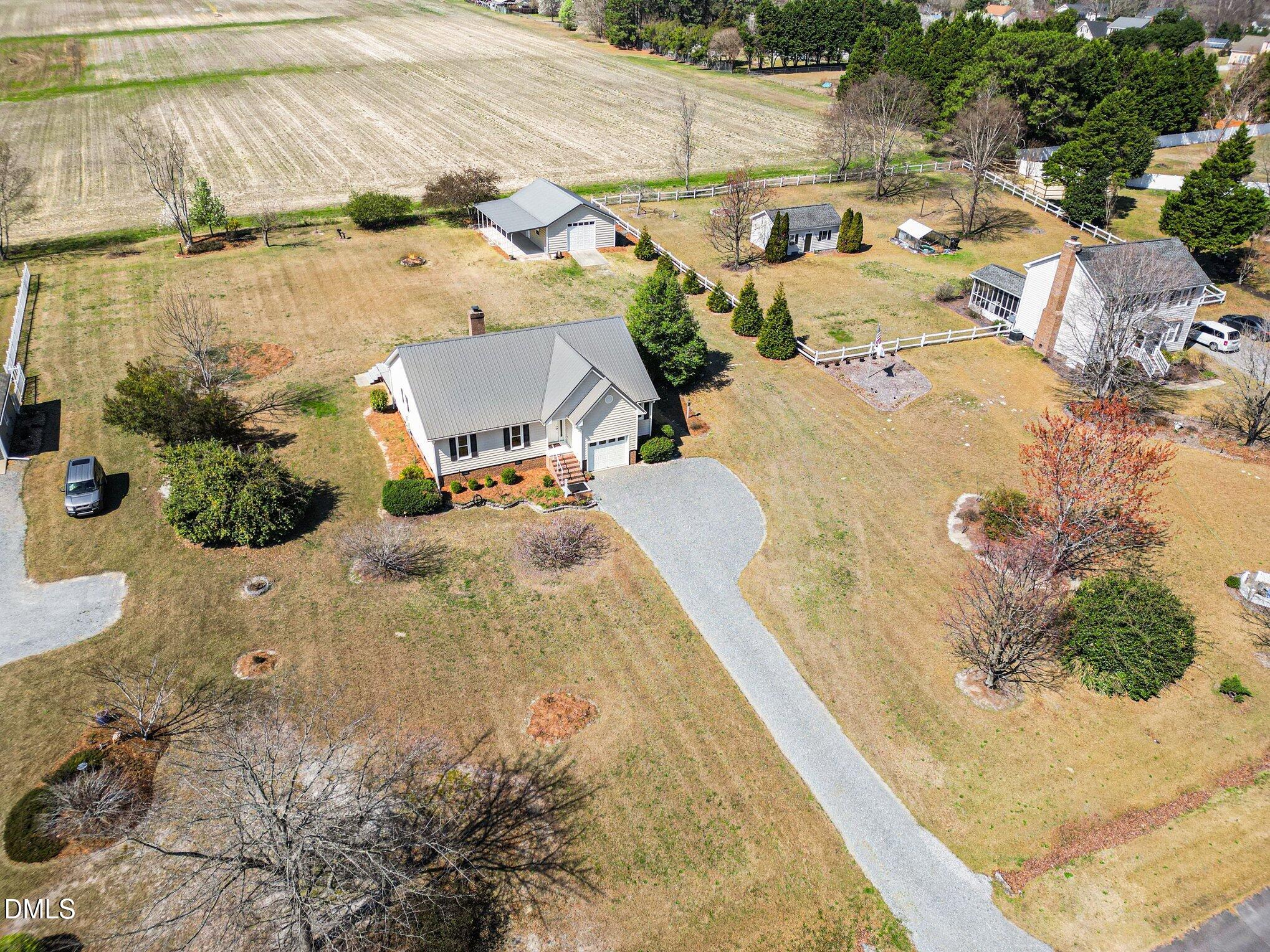 2004 Little Pond Place Willow Spring, NC 27592 - Photo 25 of 32 an aerial view of a house with a yard and lake view