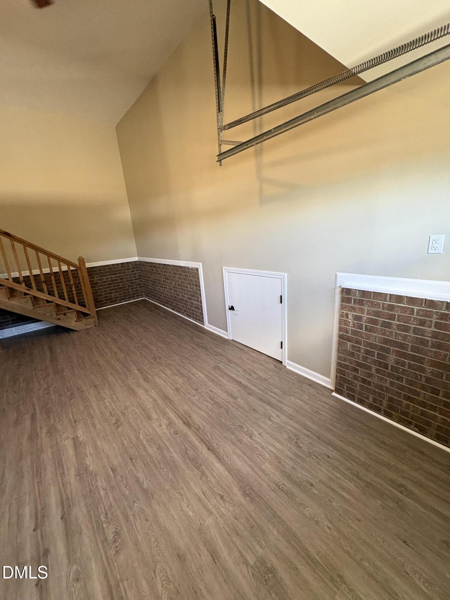 2004 Little Pond Place Willow Spring, NC 27592 - Photo 29 of 32 a view of an empty room with wooden floor and a window