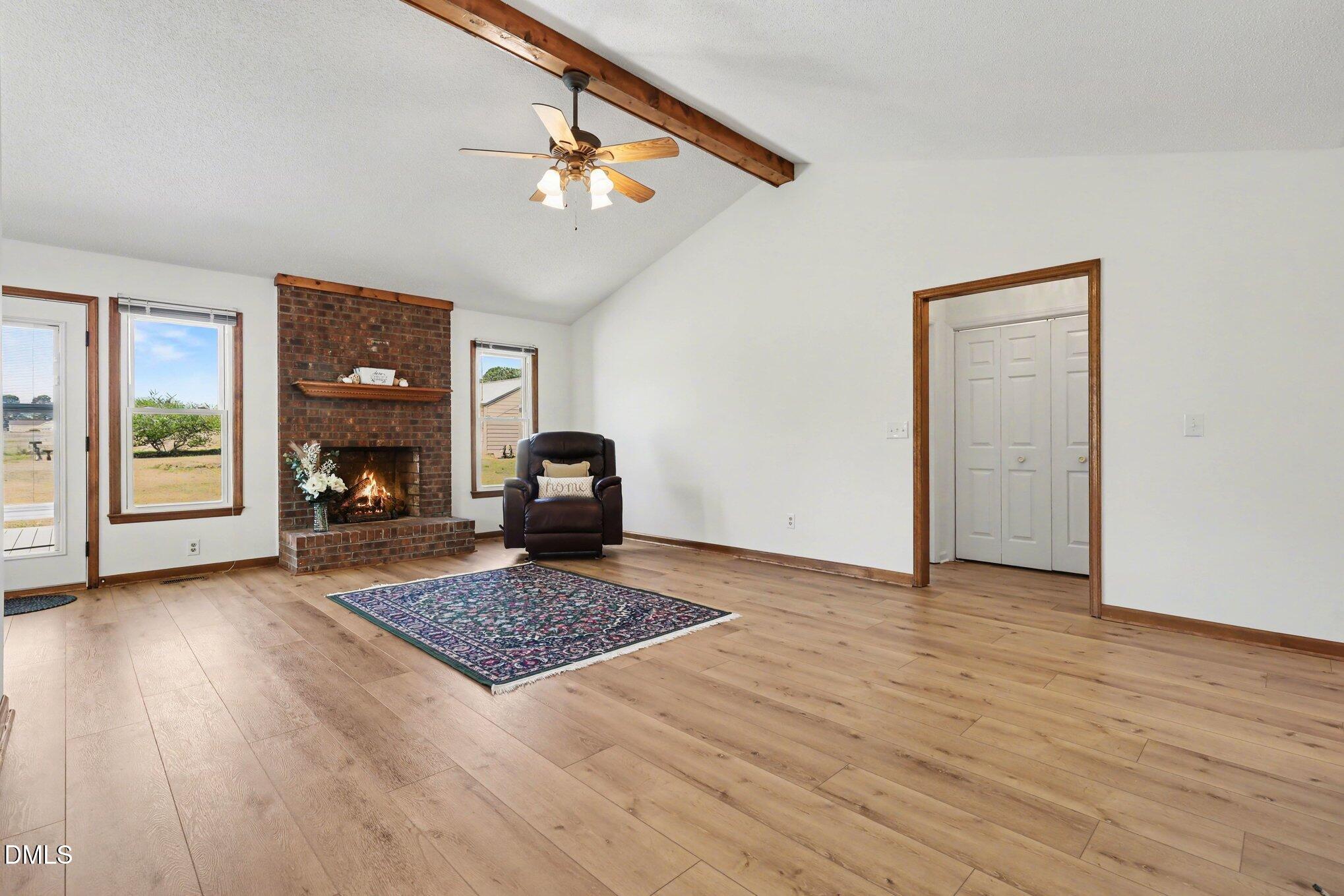 2004 Little Pond Place Willow Spring, NC 27592 - Photo 4 of 32 a living room with furniture and a fireplace