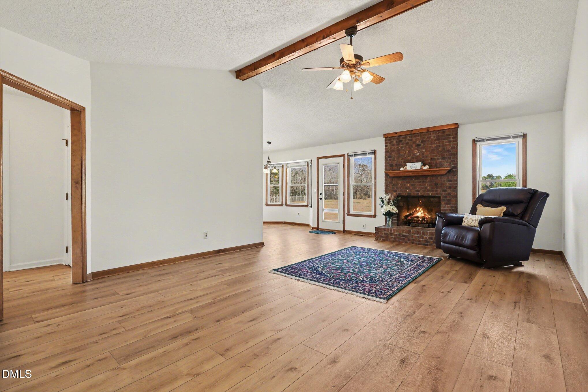 2004 Little Pond Place Willow Spring, NC 27592 - Photo 5 of 32 a living room with furniture and a rug