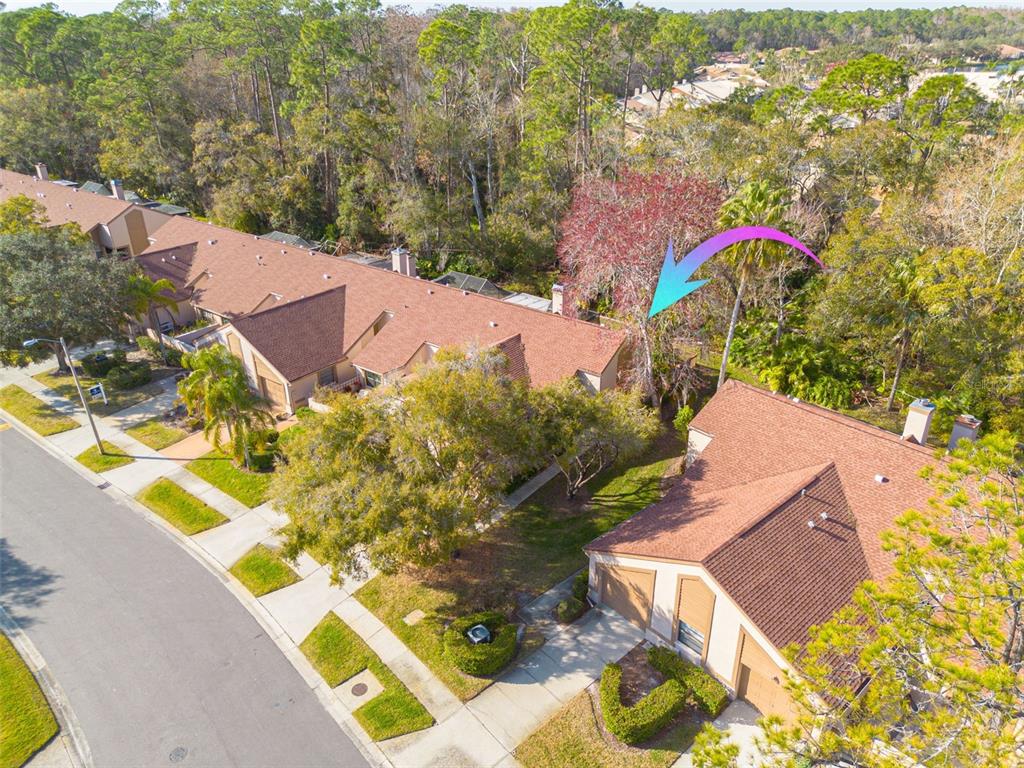 an aerial view of residential house with outdoor space and swimming pool