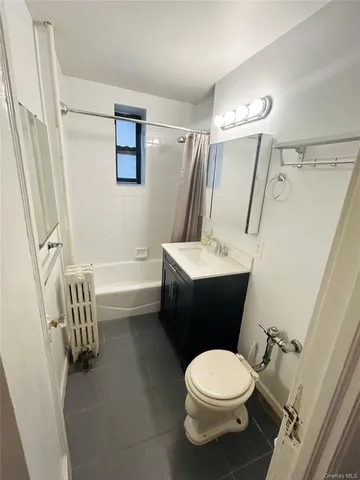a bathroom with a toilet a sink and a shower