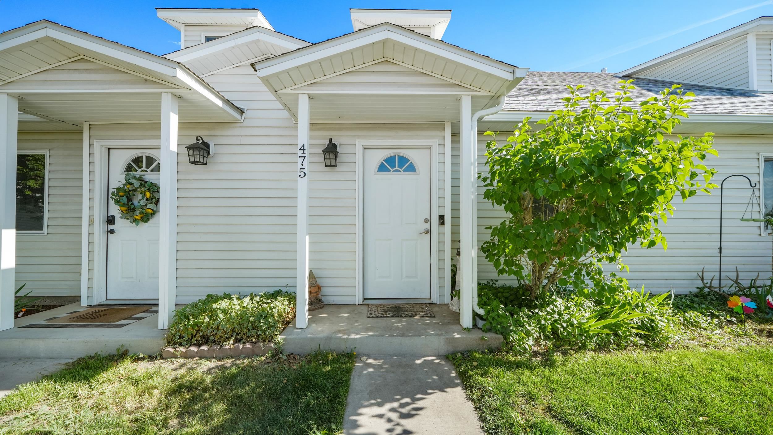 475 David Court Fruita, CO 81521 - Photo 1 of 29 front view of a house with a yard