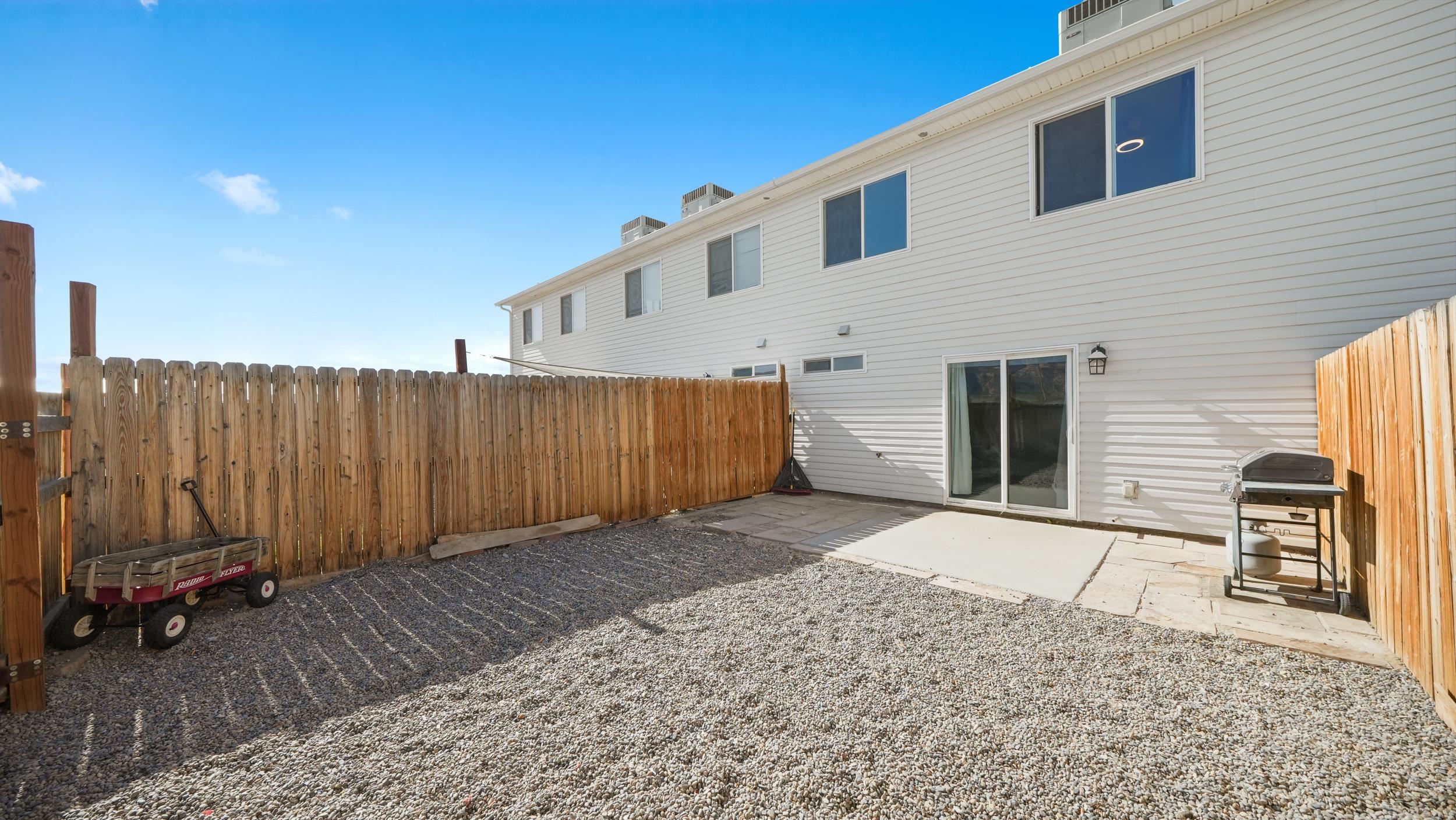 475 David Court Fruita, CO 81521 - Photo 20 of 29 a view of a house with a backyard