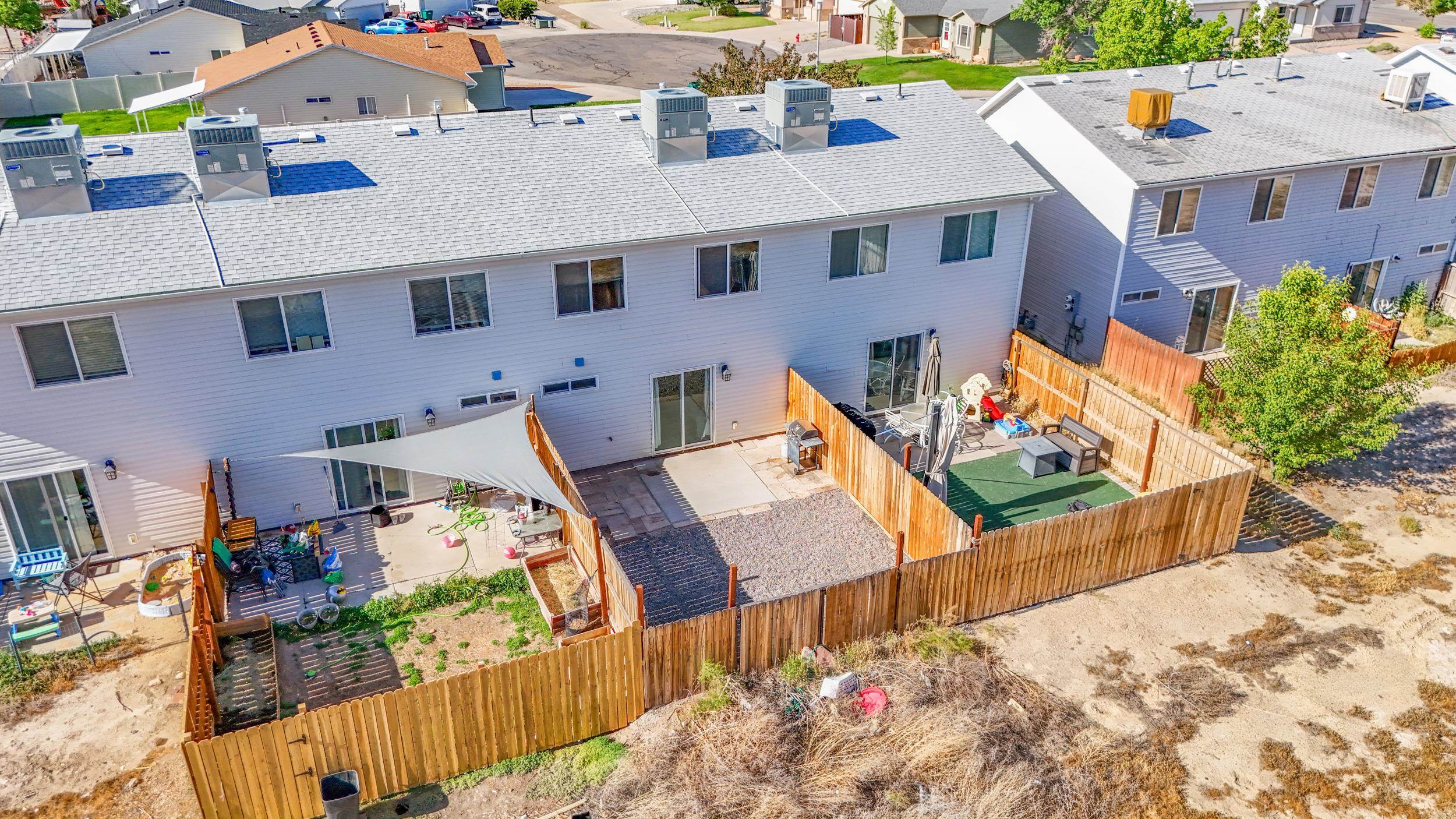 475 David Court Fruita, CO 81521 - Photo 23 of 29 an aerial view of a house with wooden fence