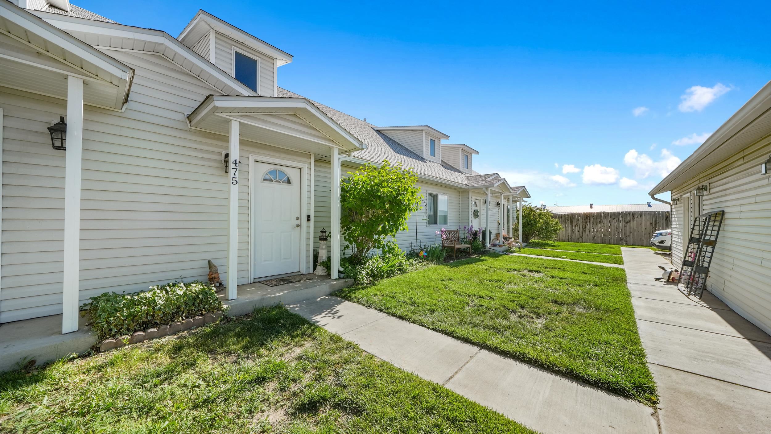 475 David Court Fruita, CO 81521 - Photo 27 of 29 a front view of a house with a yard