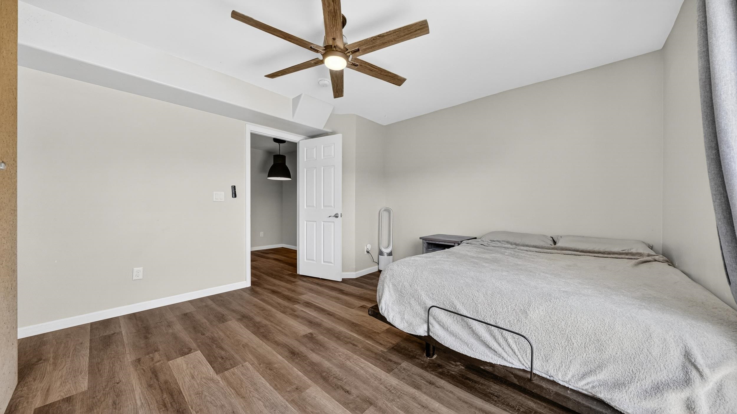 475 David Court Fruita, CO 81521 - Photo 10 of 29 a bedroom with a bed and a ceiling fan