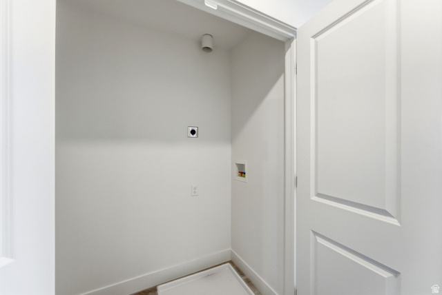 645 West 880th Street South Fillmore, UT 84631 - Photo 19 of 22 Dedicated utility area featuring white walls, baseboard trim, and a white interior door