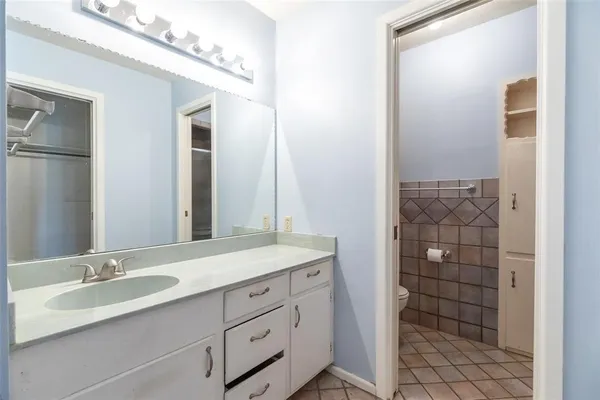 a bathroom with a double vanity sink and mirror
