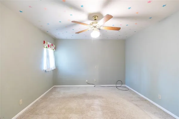 a view of a chandelier fan in a room