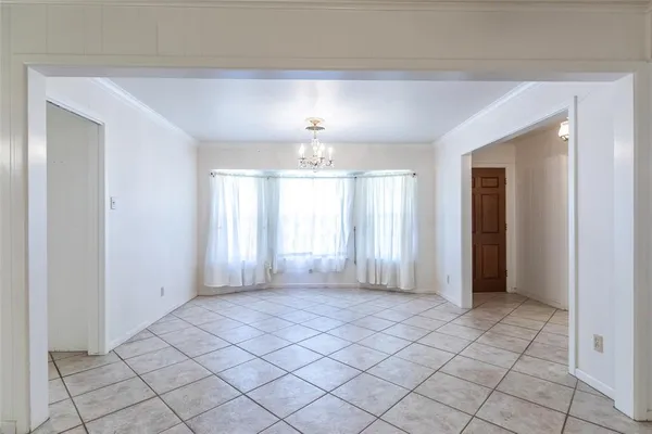 a view of an empty room and window