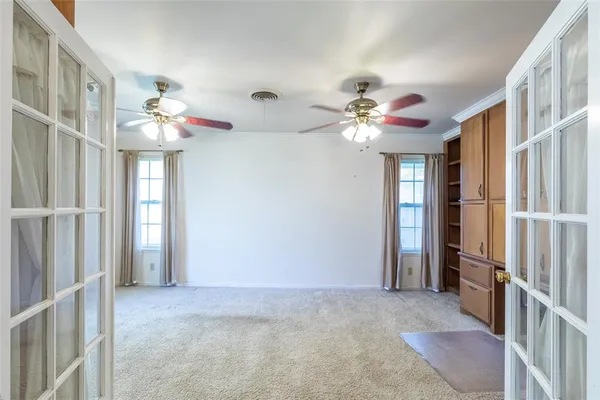wooden floor in a livingroom with a chandelier