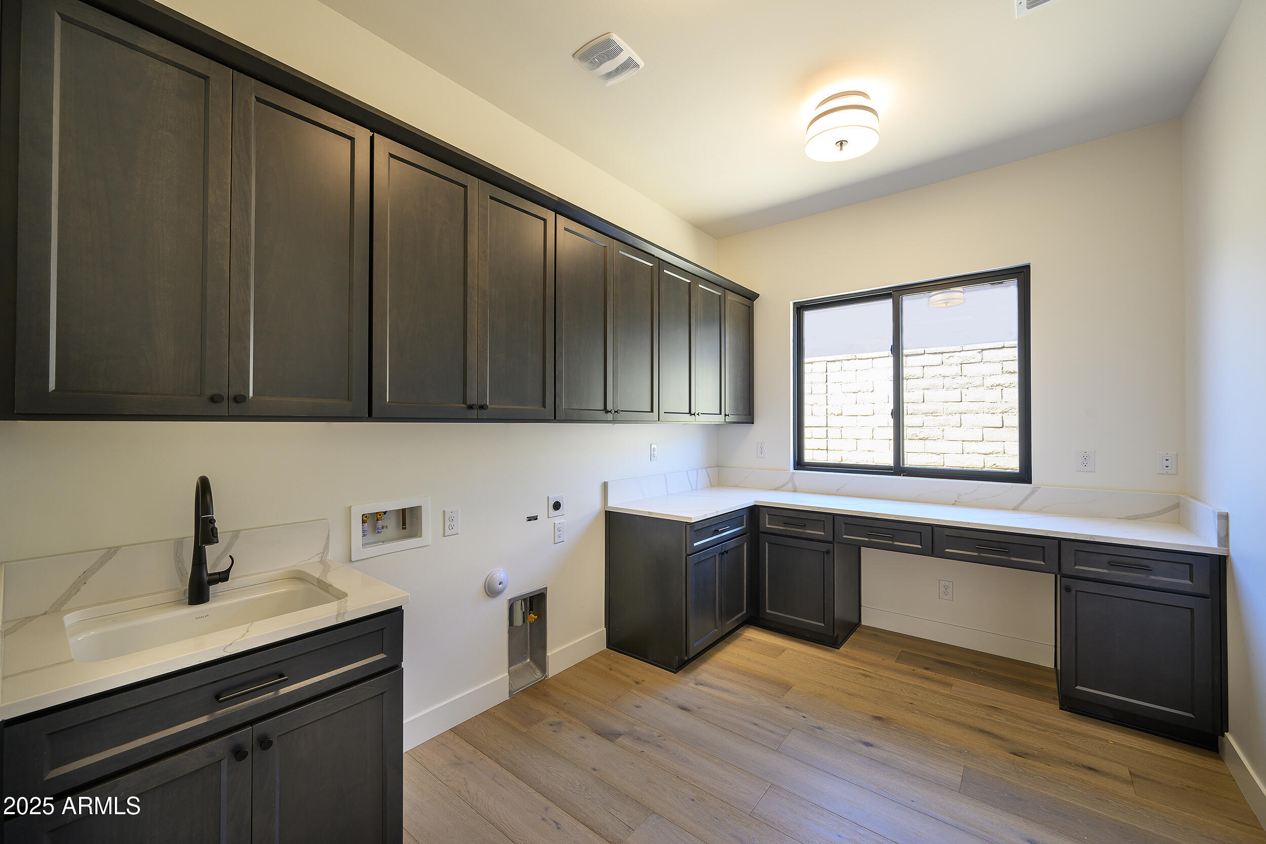 13290 East La Junta Road Scottsdale, AZ 85255 - Photo 13 of 15 a view of a kitchen with sink dishwasher and wooden floor