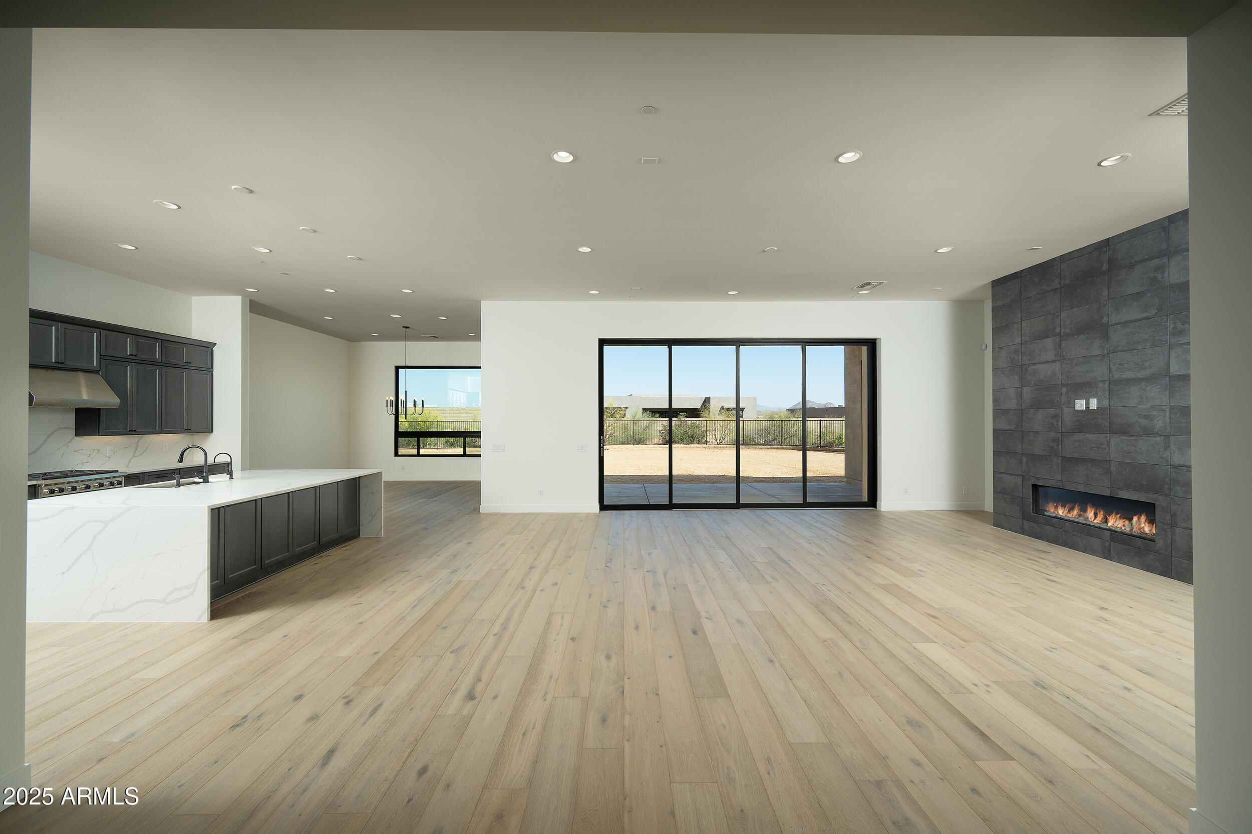 13290 East La Junta Road Scottsdale, AZ 85255 - Photo 5 of 15 a view of an empty room with a kitchen and a window