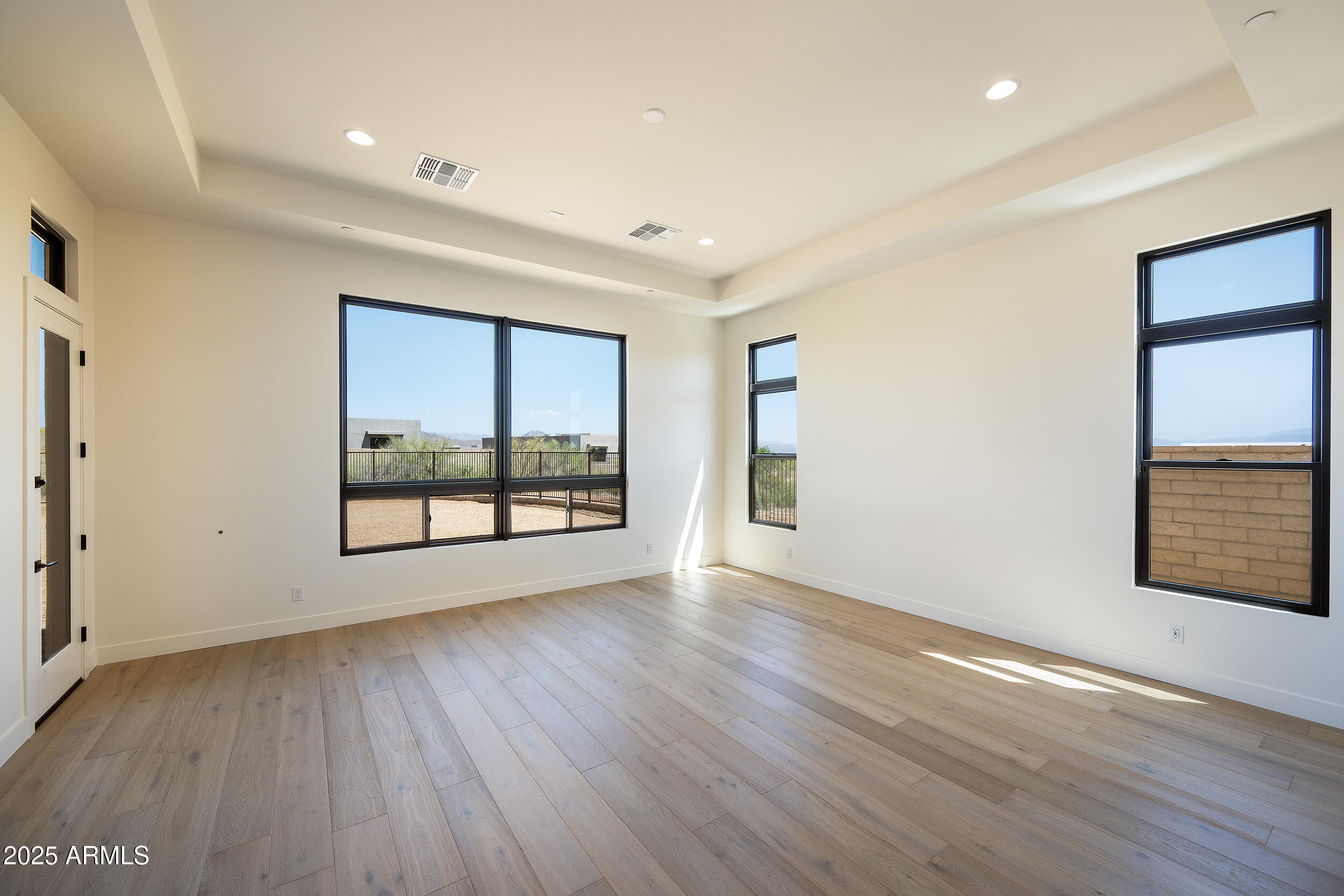 13290 East La Junta Road Scottsdale, AZ 85255 - Photo 8 of 15 wooden floor in an empty room with a window