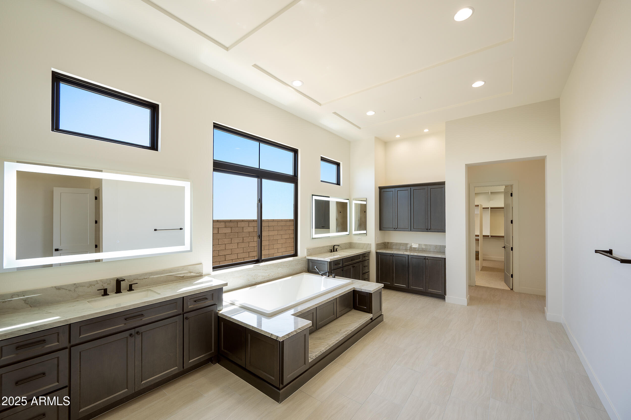 13290 East La Junta Road Scottsdale, AZ 85255 - Photo 9 of 15 a large white room with a large window and furniture