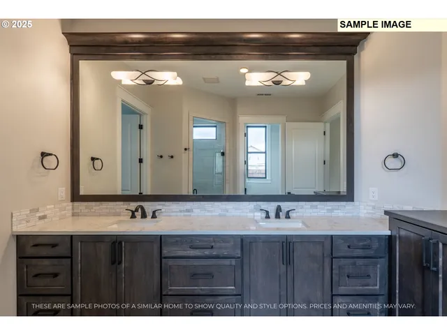 a bathroom with a double vanity sink and a mirror